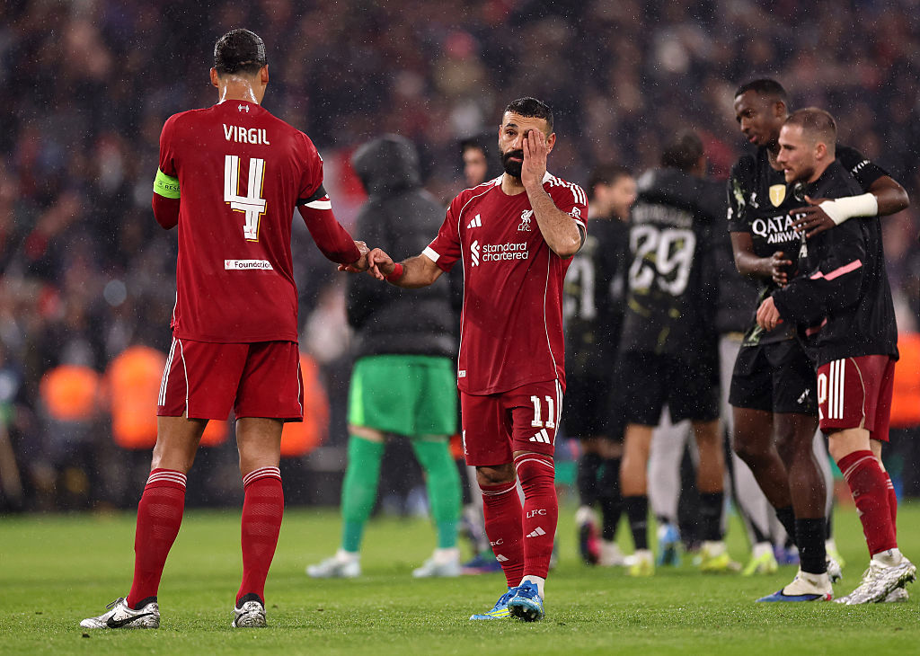 Virgil van Dijk and Mohamed Salah of Liverpool look dejected after the team's defeat.