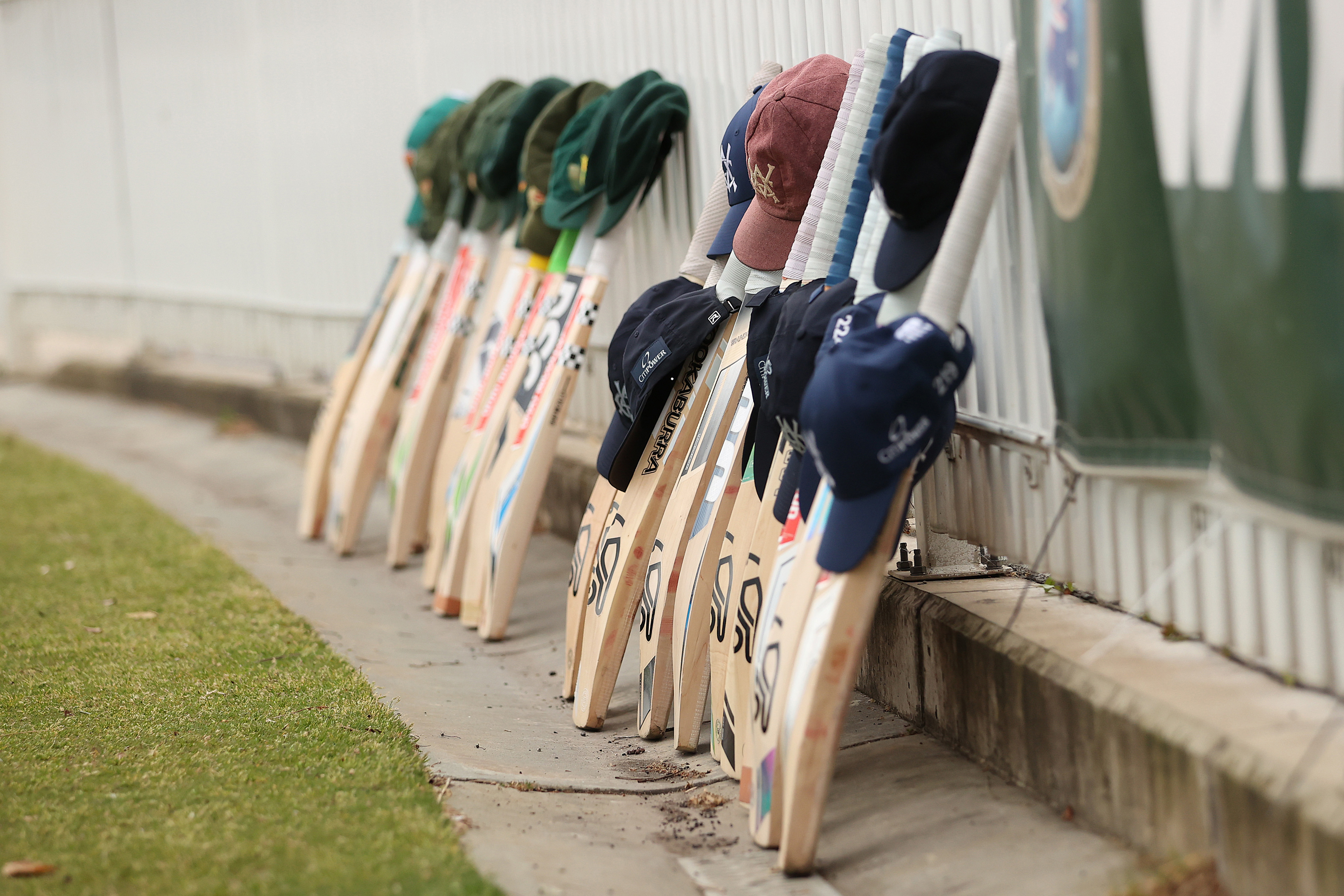 MELBOURNE, AUSTRALIA - OCTOBER 31: Victorian and Tasmanian players lay their bats and caps in honour of the late Ben Austin during day four of the Sheffield Shield  match between Victoria and Tasmania at CitiPower Centre, on October 31, 2025, in Melbourne, Australia. 