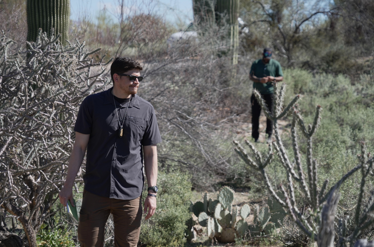 Law enforcement agents check vegetation areas around Nancy Guthrie's home in Tucson, Arizona.