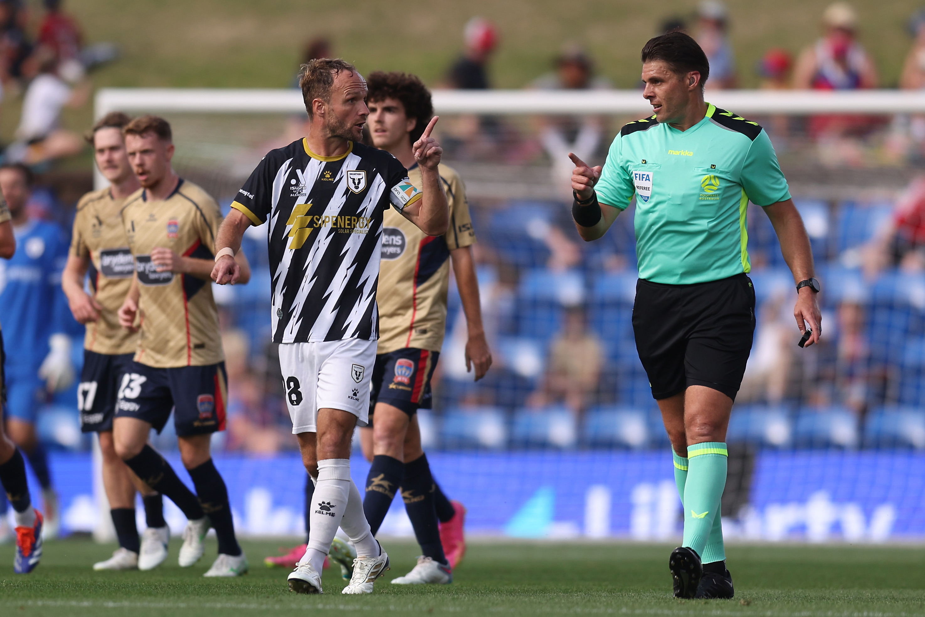 Valere Germain of Macarthur FC gestures to referee Shaun Evans during the round 13 A-League match between Newcastle Jets and Macarthur FC at McDonald Jones Stadium, on January 12, 2025, in Newcastle, Australia. (Photo by Scott Gardiner/Getty Images)