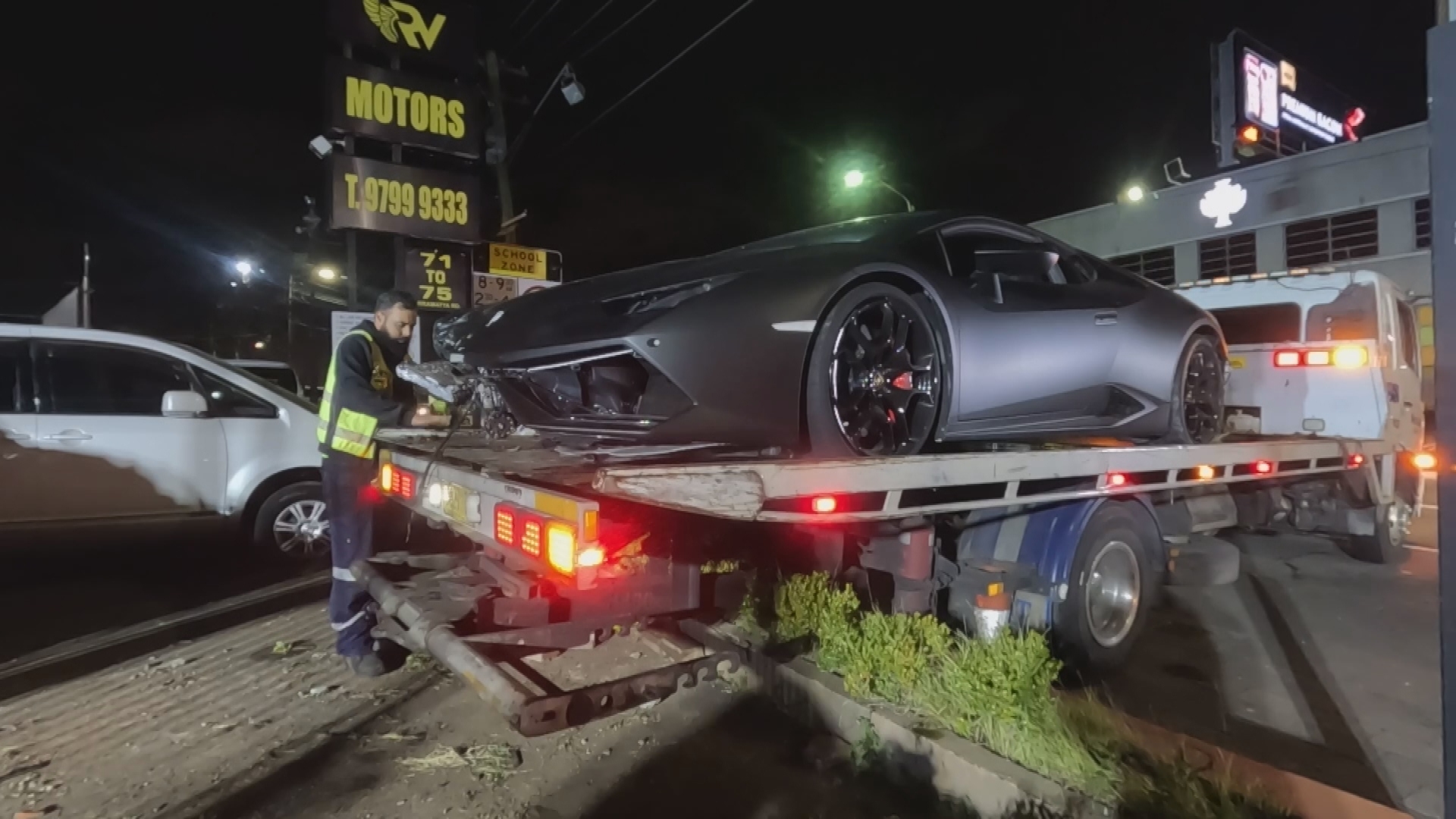 Police are investigating after a rented black Lamborghini crashed into a car yard in Sydney overnight.