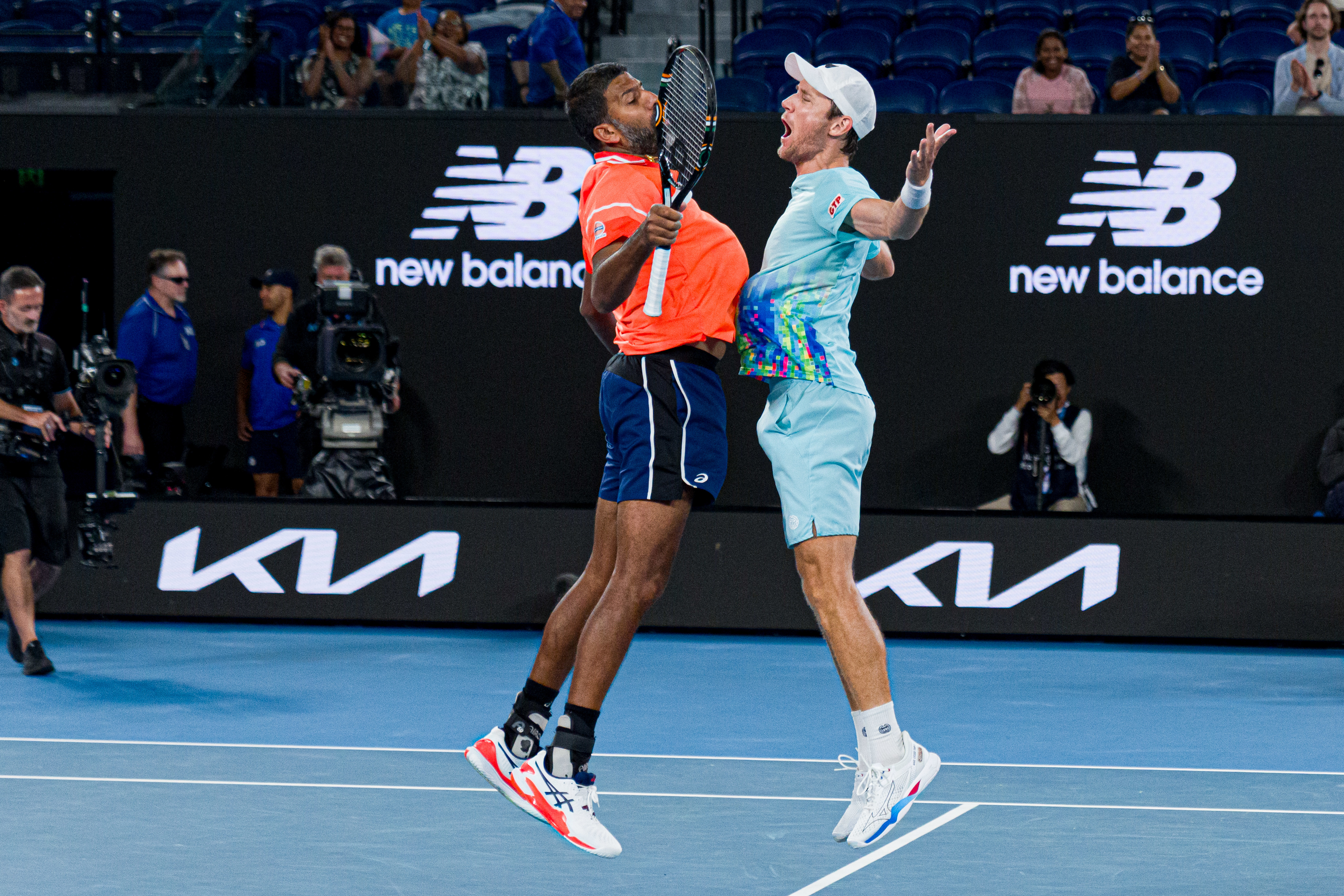 Rohan Bopanna and Matthew Ebden celebrate winning match point during their men's doubles semi-final match at the 2024 Australian Open.