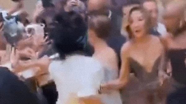 Looper: Ariana Grande is rushed by fan on red carpet