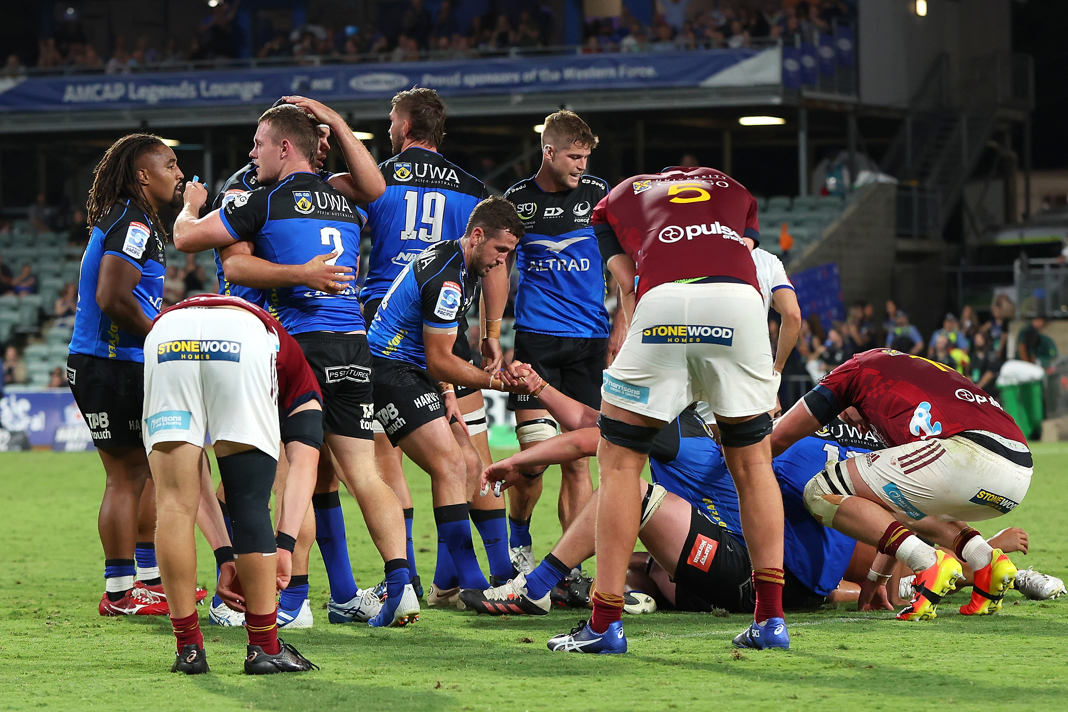 The Force celebrate winning the round nine Super Rugby Pacific match against the Highlanders.