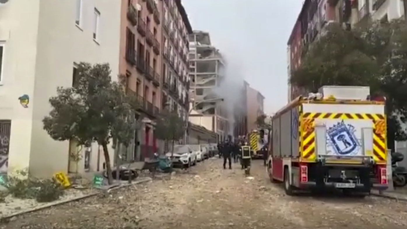 In this image made from video provided by Emergencias Madrid, firefighters attend the scene after an explosion in Madrid, Wednesday, Jan. 20, 2021.