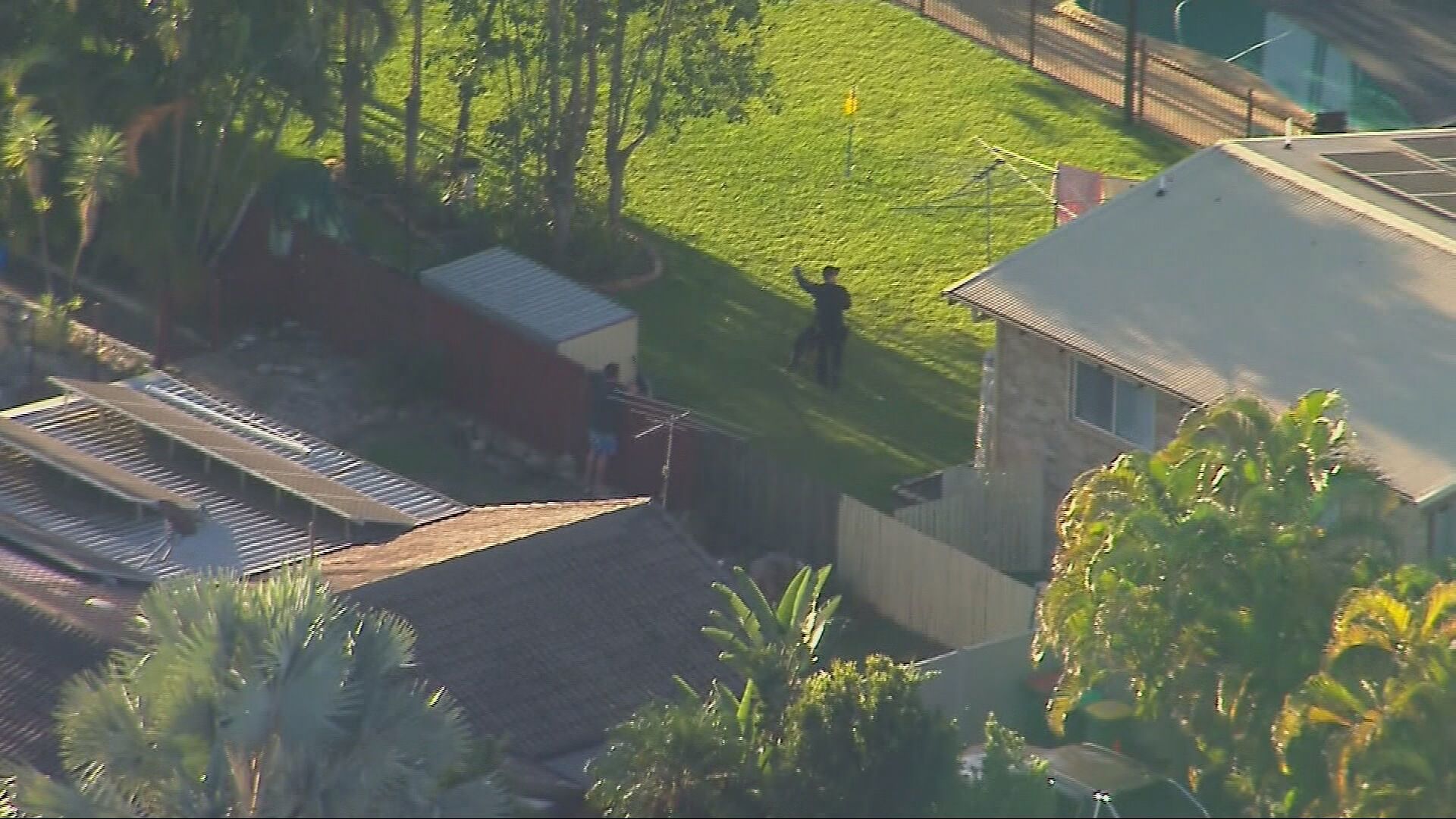 Suburban manhunt under way for shirtless man accused of ramming police car