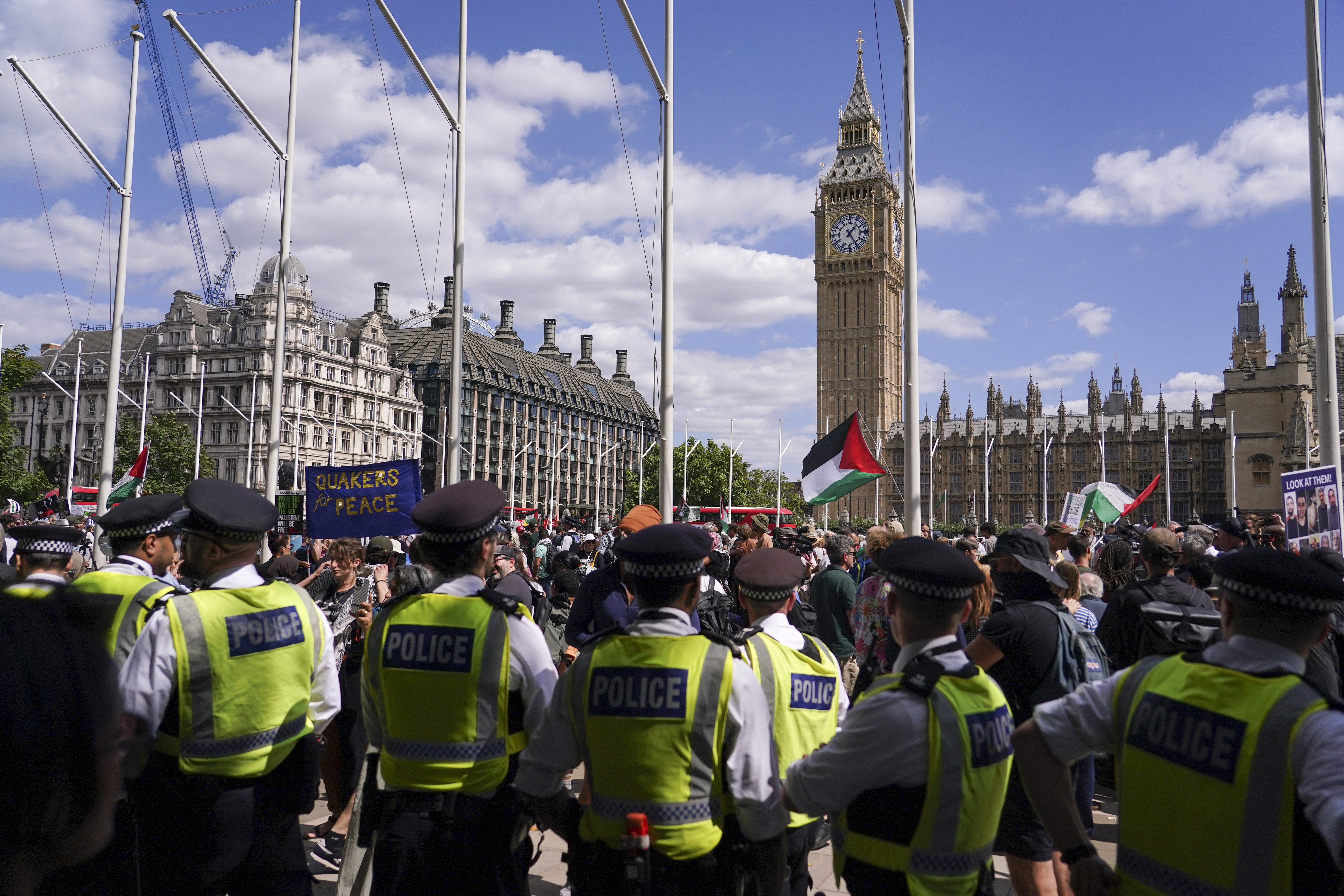 Police officers arrest a demonstrator during a protest in support of the Palestinian People in Gaza, in Parliament Square, in London