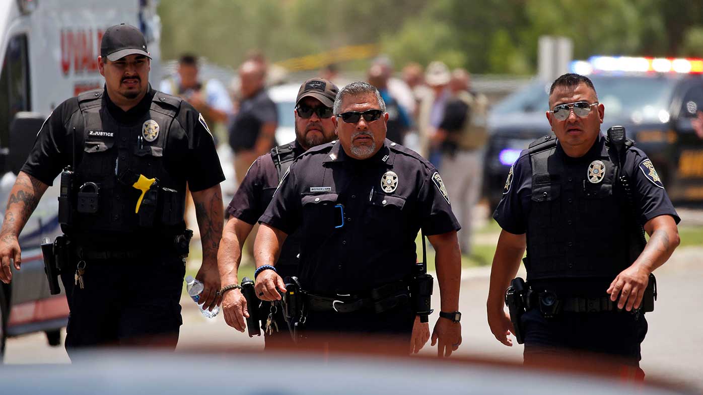 Police outside Robb Elementary School in Uvalde, Texas, following a mass shooting.