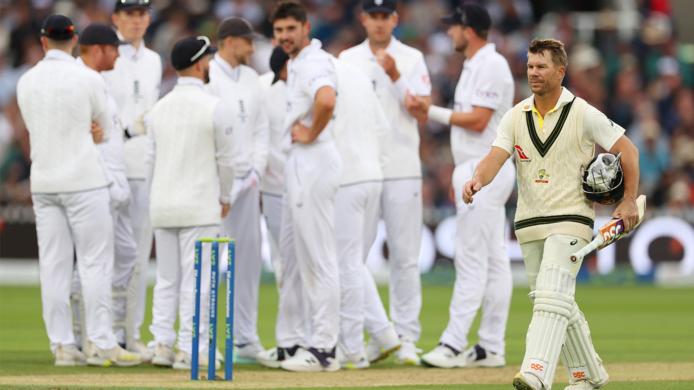 David Warner of Australia leaves the field after being dismissed.