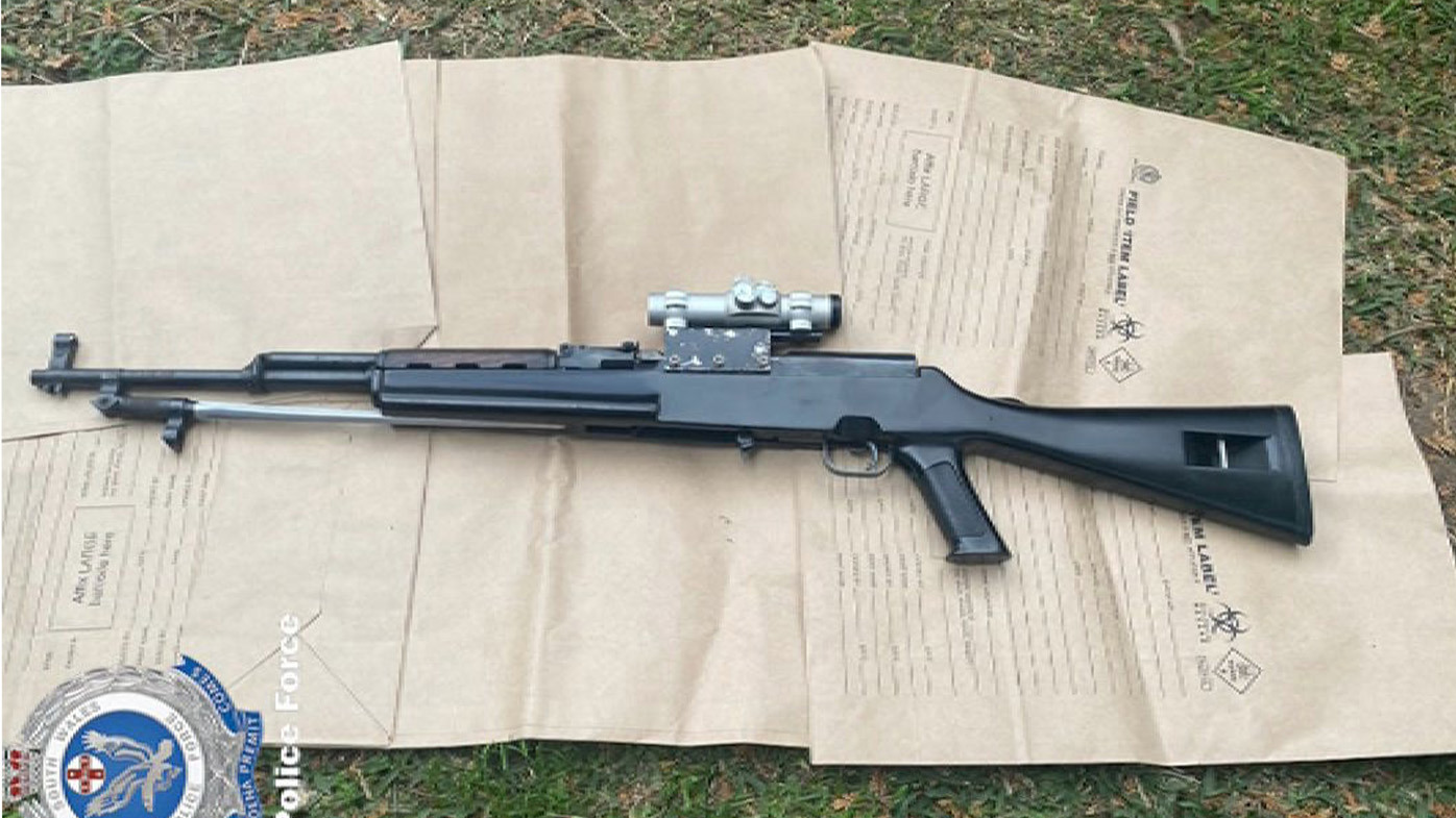 Two bikie members have been charged in Sydney after an alleged shooting on the Eastern beaches﻿. A semi-Automatic rifle was found at a Campbell town property 