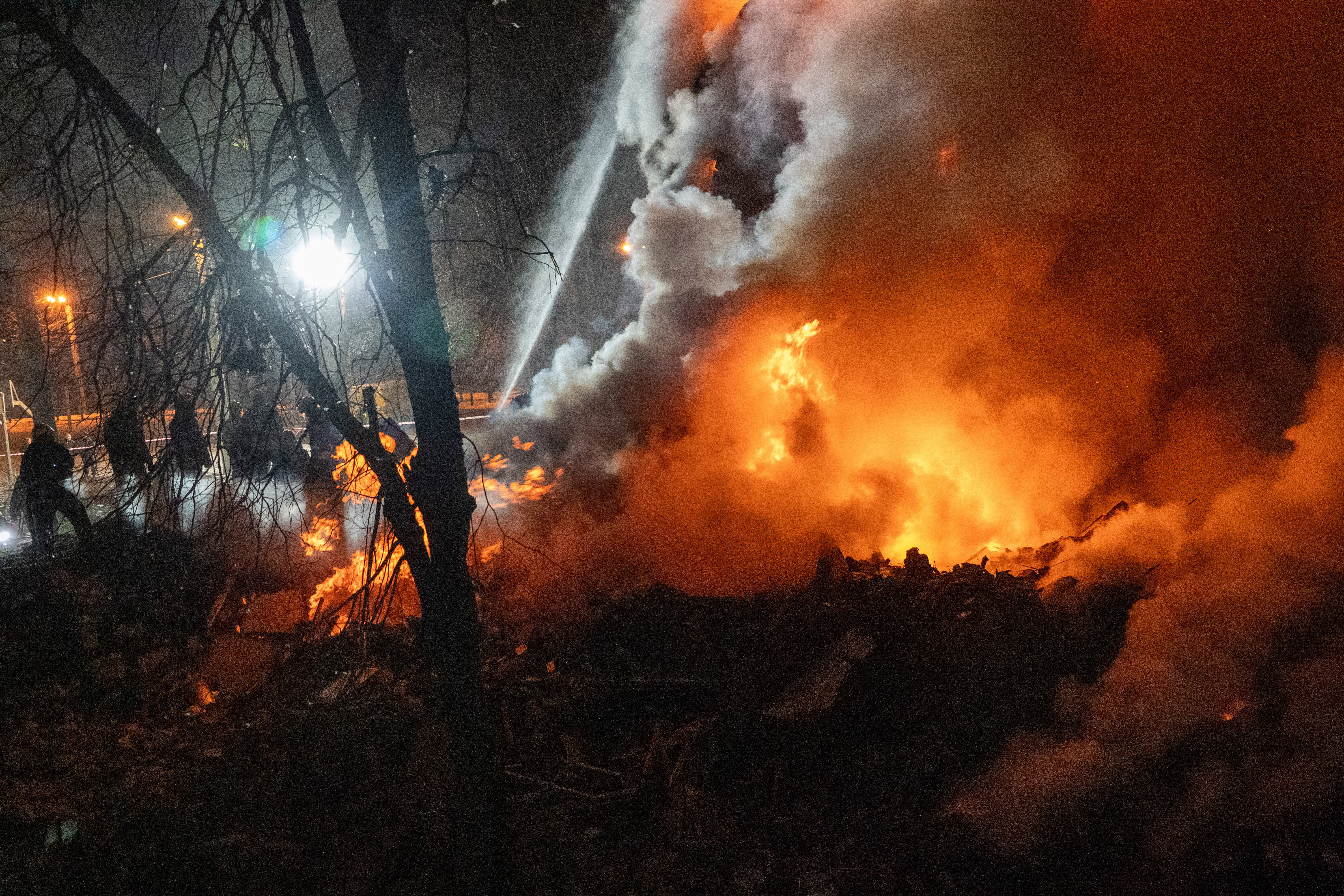 Firefighters put out the fire in an multi-storey apartment building following a Russian missile attack in Kharkiv, Ukraine, Saturday, March 7, 2026.