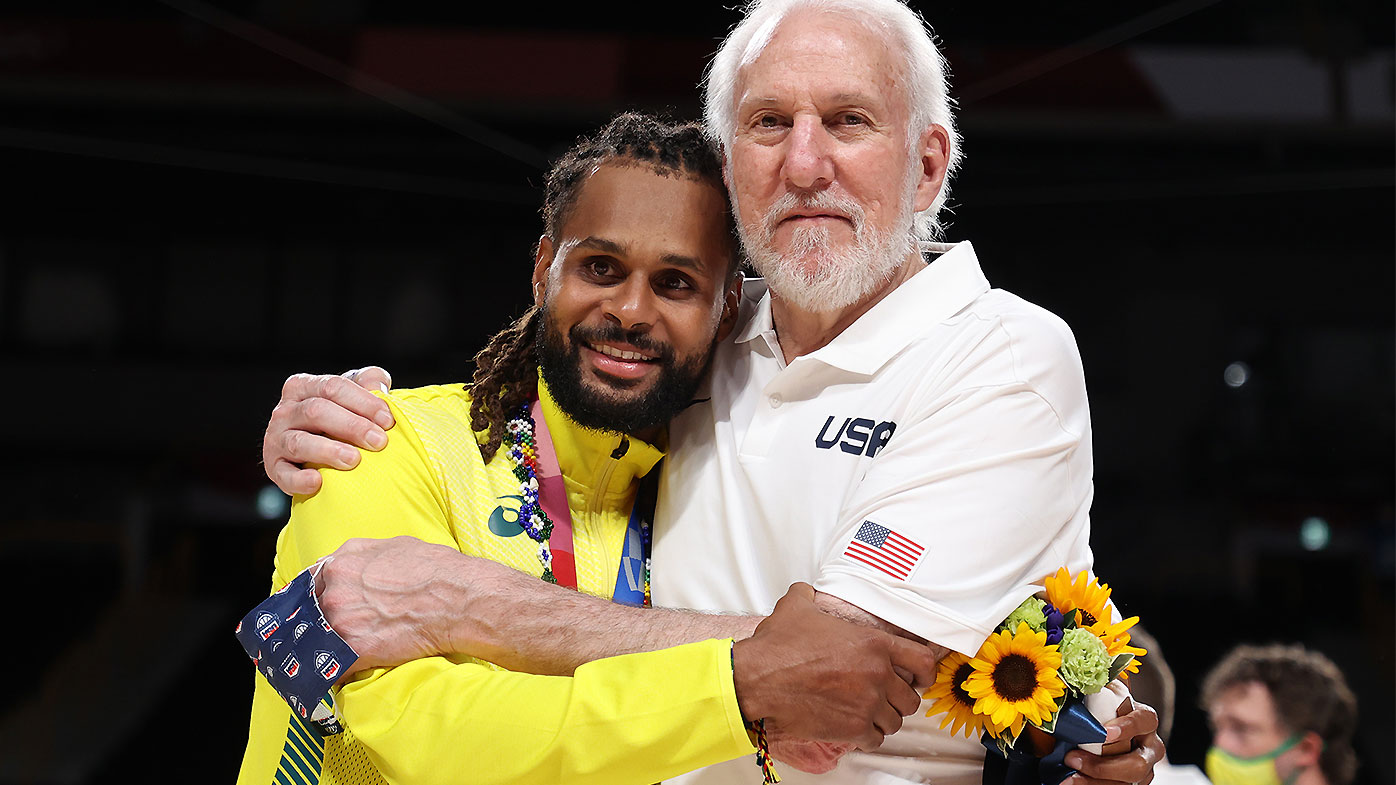 Patty Mills and Gregg Popovich