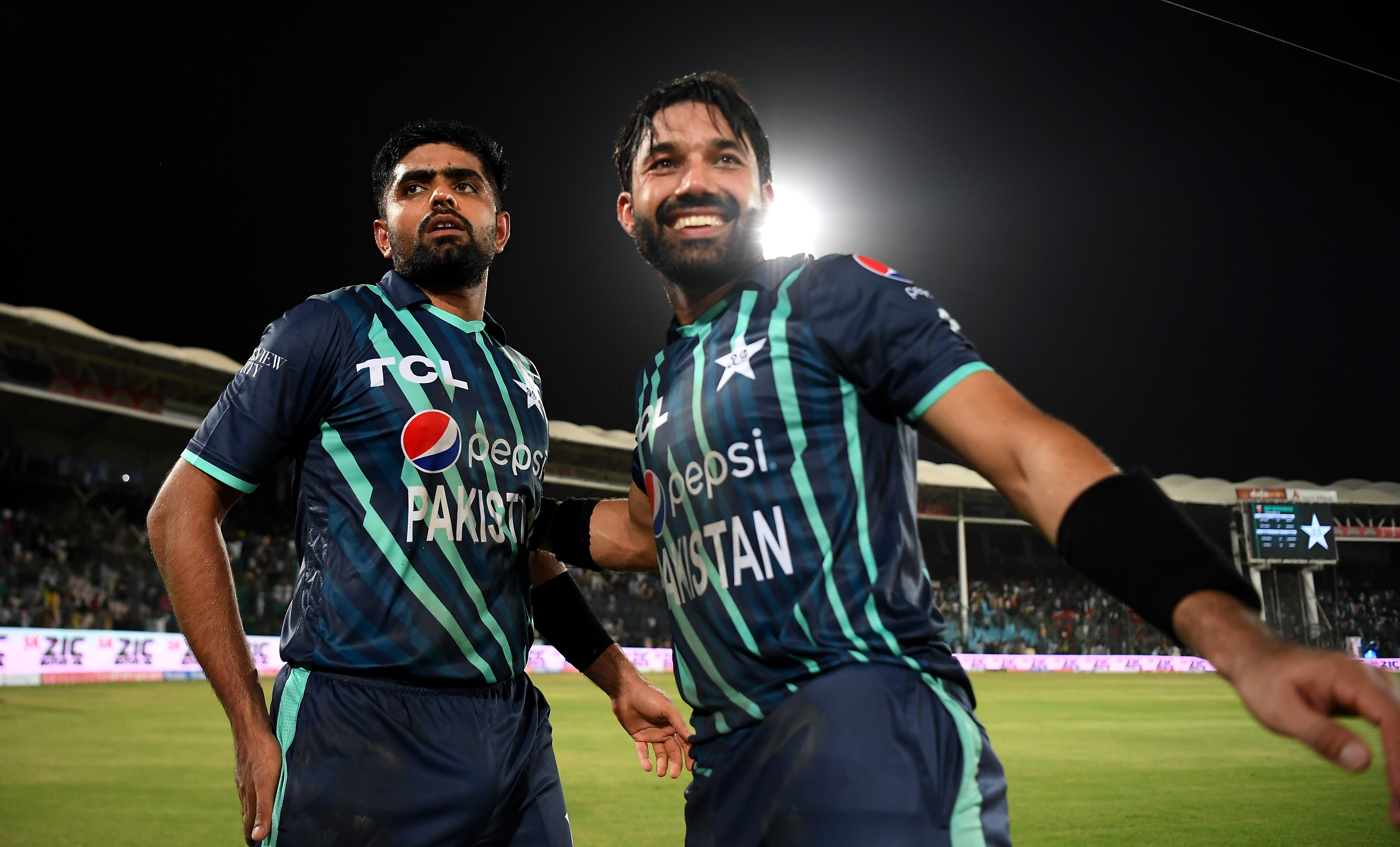 Babar Azam and Mohammad Rizwan of Pakistan celebrate victory after the 2nd IT20 match between Pakistan and England on September 22, 2022 in Karachi, Pakistan. (Photo by Alex Davidson/Getty Images)