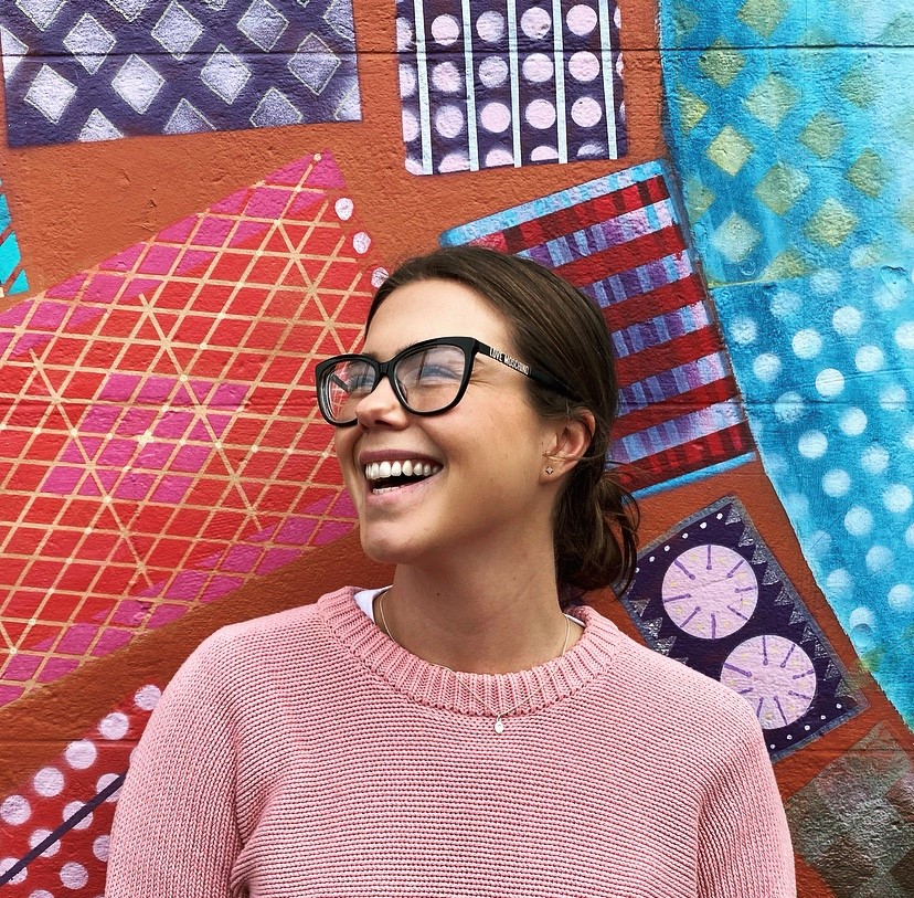 Taylor Gartner laughing in glasses.