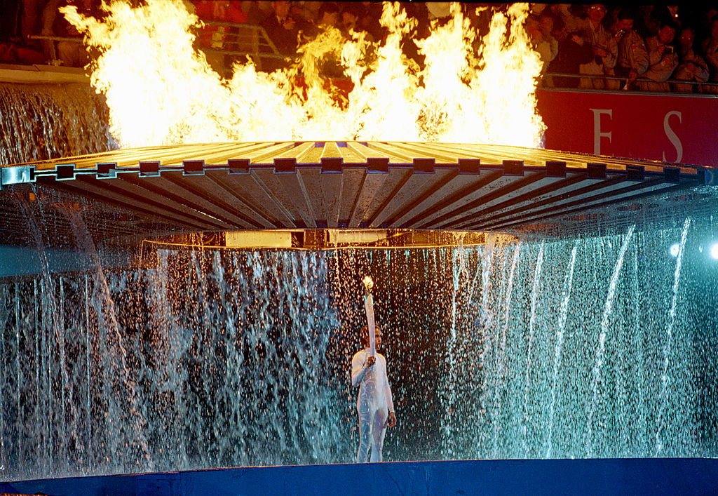 15 Sep 2000: The Cauldron containing the Olympic Flame rises above Torch Bearer Cathy Freeman of Australia during the Opening Ceremony of the Sydney 2000 Olympic Games at the Olympic Stadium in Homebush Bay, Sydney, Australia. \ Mandatory Credit: Billy Stickland /Allsport