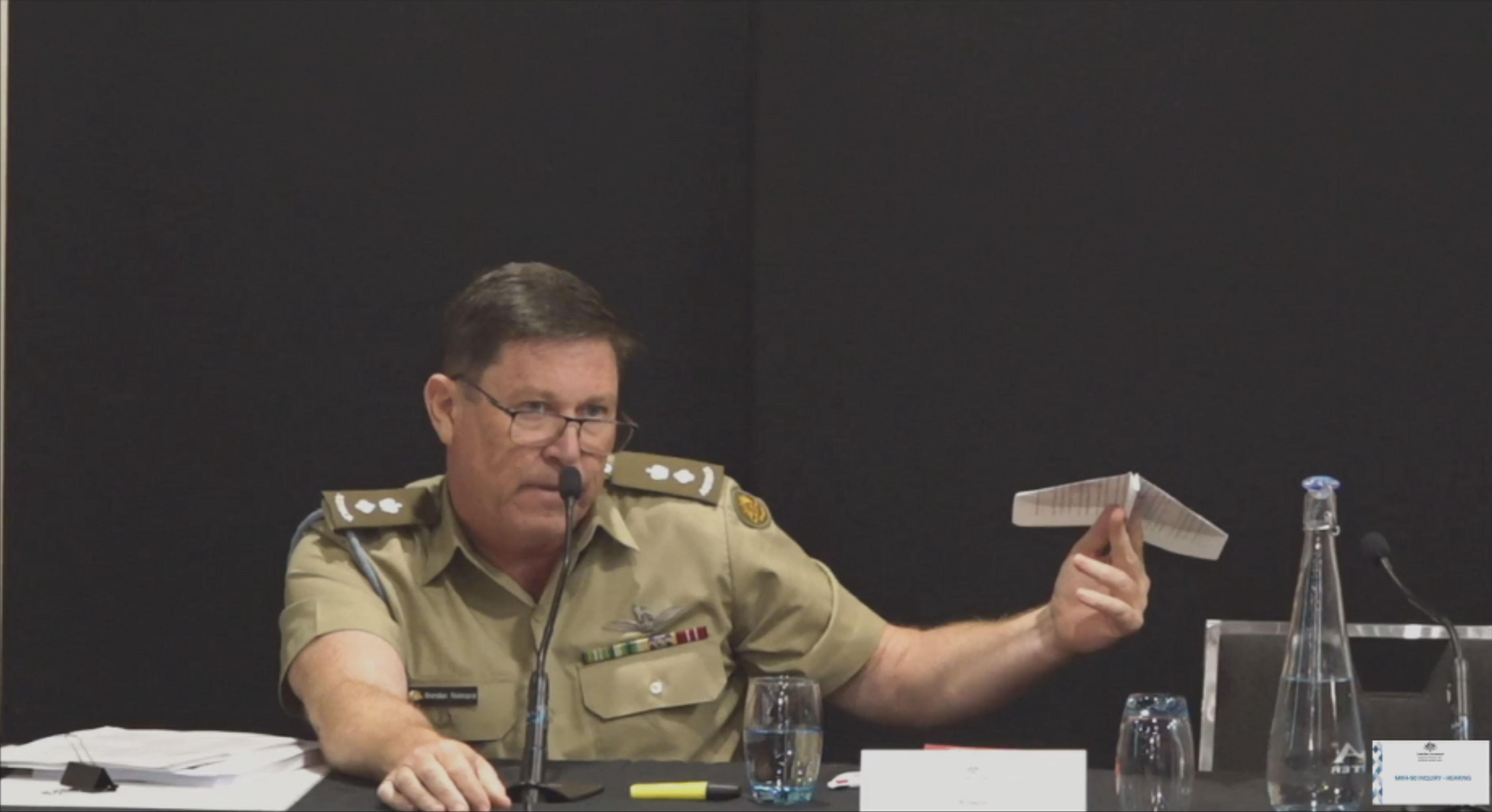 Lieutenant Colonel Brendan Reinhardt used a paper aeroplane to explain the aviation concept during the inquiry.