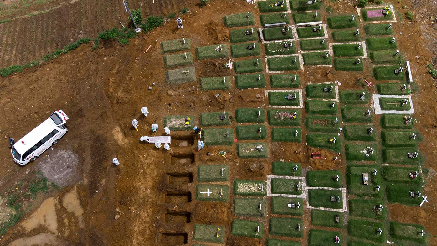 Coffins are buried at an expanding cemetery in Sumatra, Indonesia.