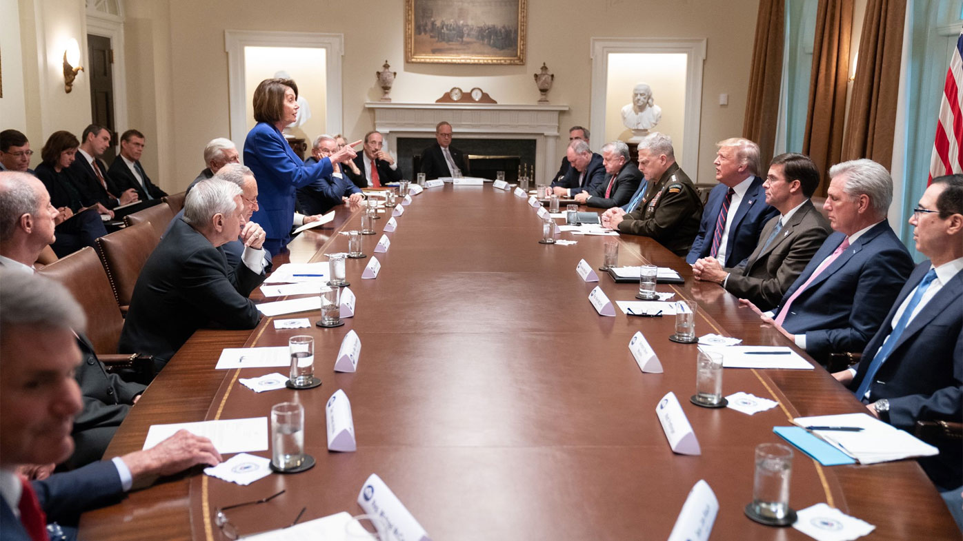 Speaker Nancy Pelosi and President Donald Trump speak to each other in a meeting at the White House.