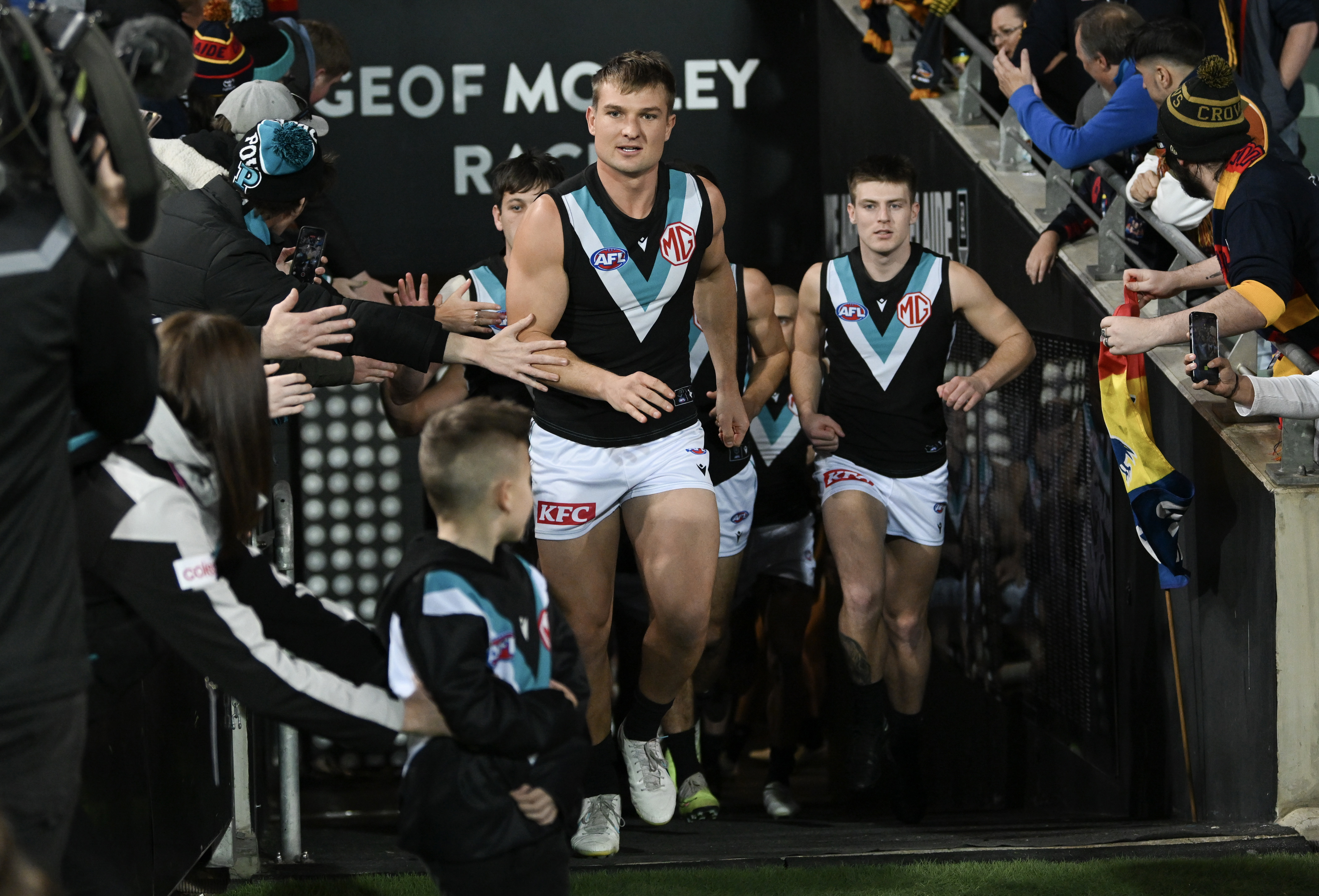  Ollie Wines of Port Adelaide leads his team out during the round 20 AFL match between Adelaide Crows and Port Adelaide Power at Adelaide Oval, on July 29, 2023, in Adelaide, Australia. (Photo by Mark Brake/Getty Images)