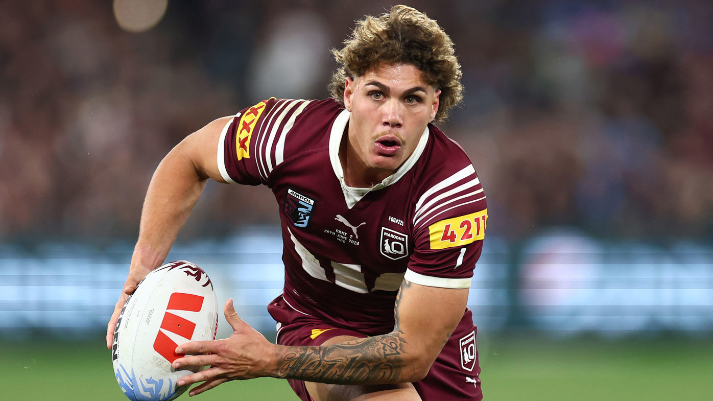 Maroons star Reece Walsh runs the ball against the Blues in State of Origin II, 2024.