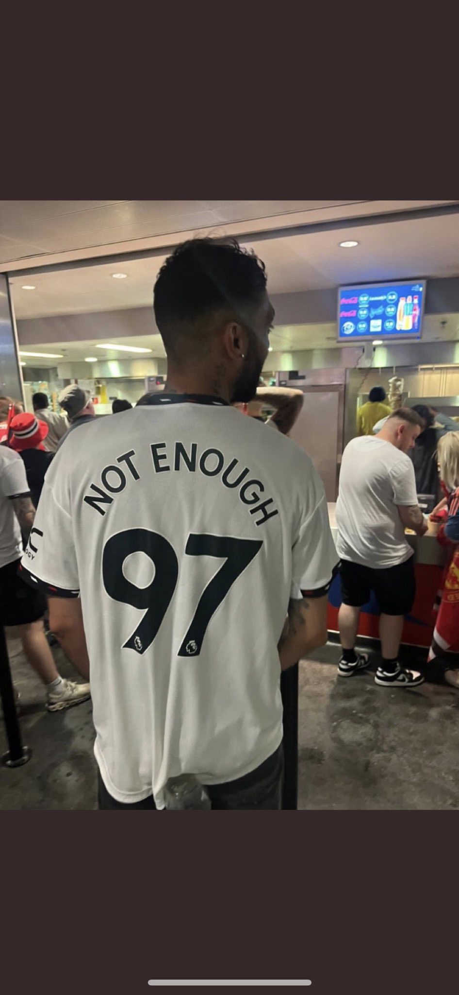 The man was arrested for wearing the offensive shirt.