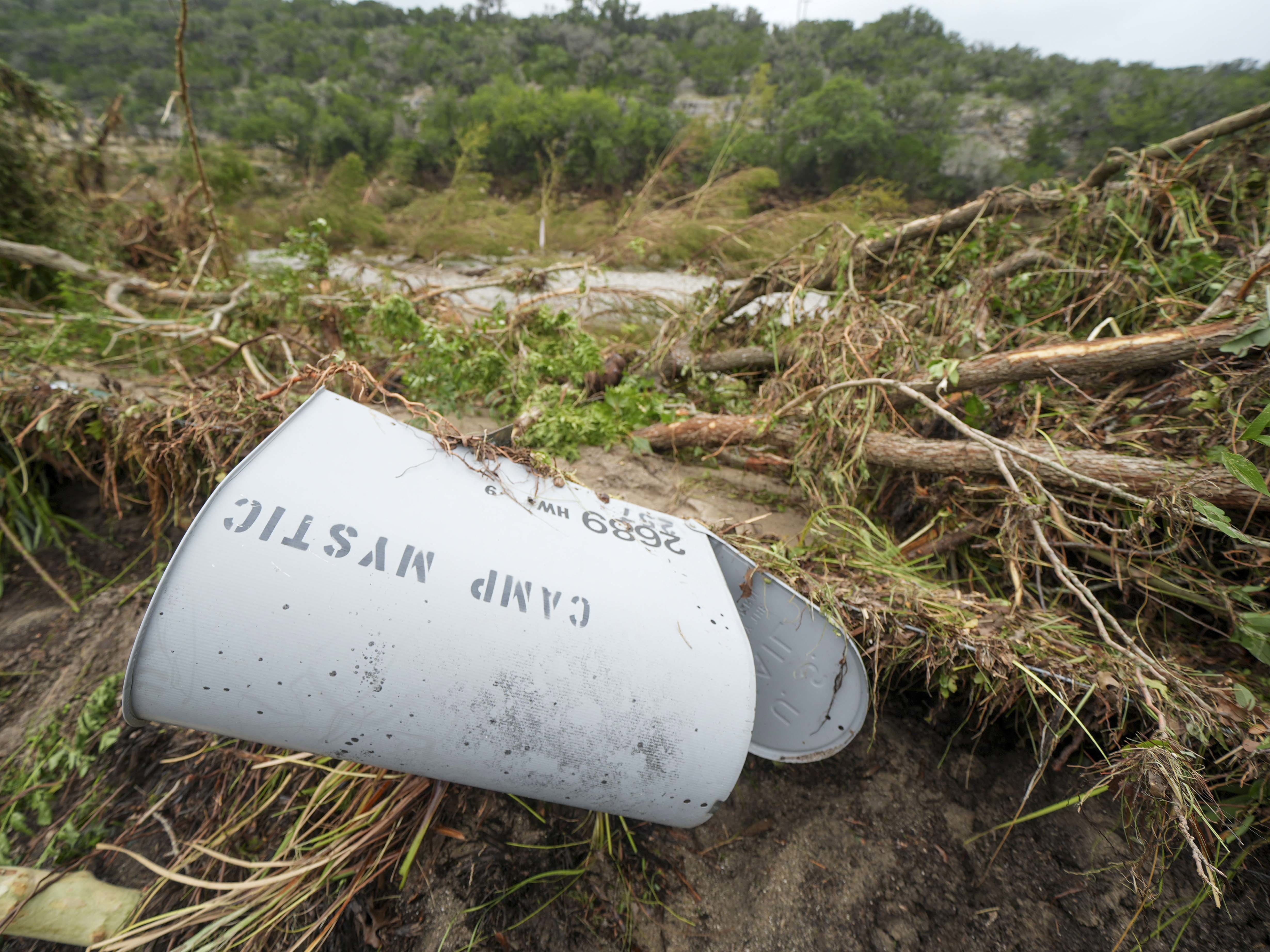 A Camp Mystic mailbox is seen near the entrance to the establishment along the banks of the Guadalupe River after a flash flood swept through the area.