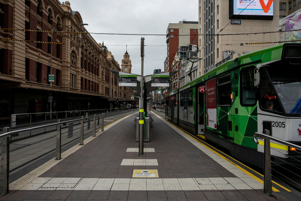 MELBOURNE, AUSTRALIA - JULY 16: A general view of an empty Flinders Street on July 16, 2021 in Melbourne, Australia. Lockdown restrictions have come into effect across Victoria as health authorities work to contain two COVID-19 outbreaks linked to Sydney's delta strain coronavirus cluster. The snap five-day lockdown, which came into effect at midnight on Thursday, was called after more new COVID-19 cases and exposure sites were confirmed across the state. Under the lockdown restrictions, Victori