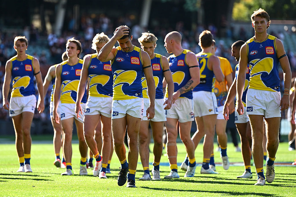 The Eagles look dejected after losing the round five AFL match against Carlton Blues.