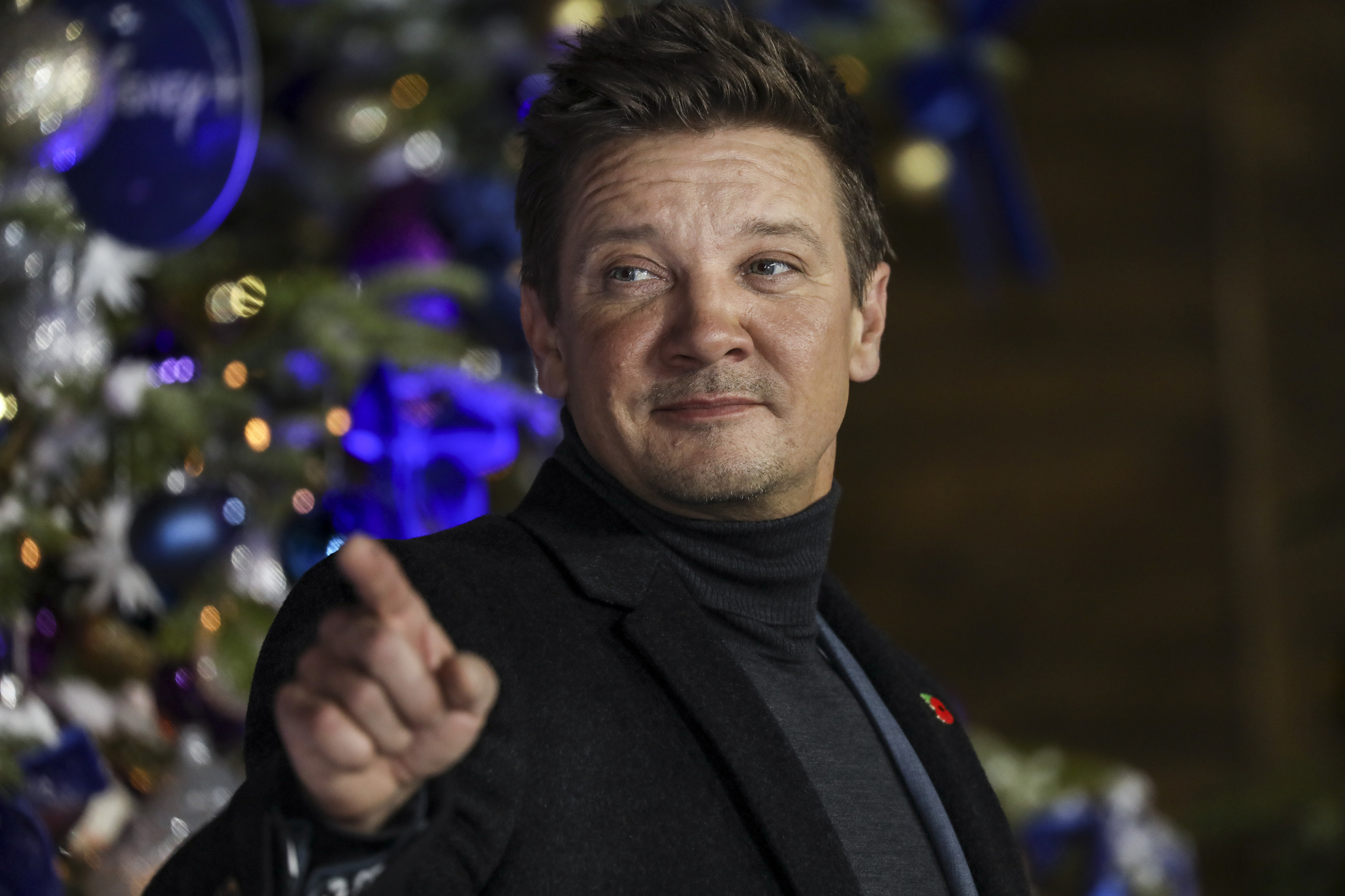 Jeremy Renner poses for photographers upon arrival at the UK Fan Screening of the film "Hawkeye," in London, Thursday, Nov. 11, 2021. 