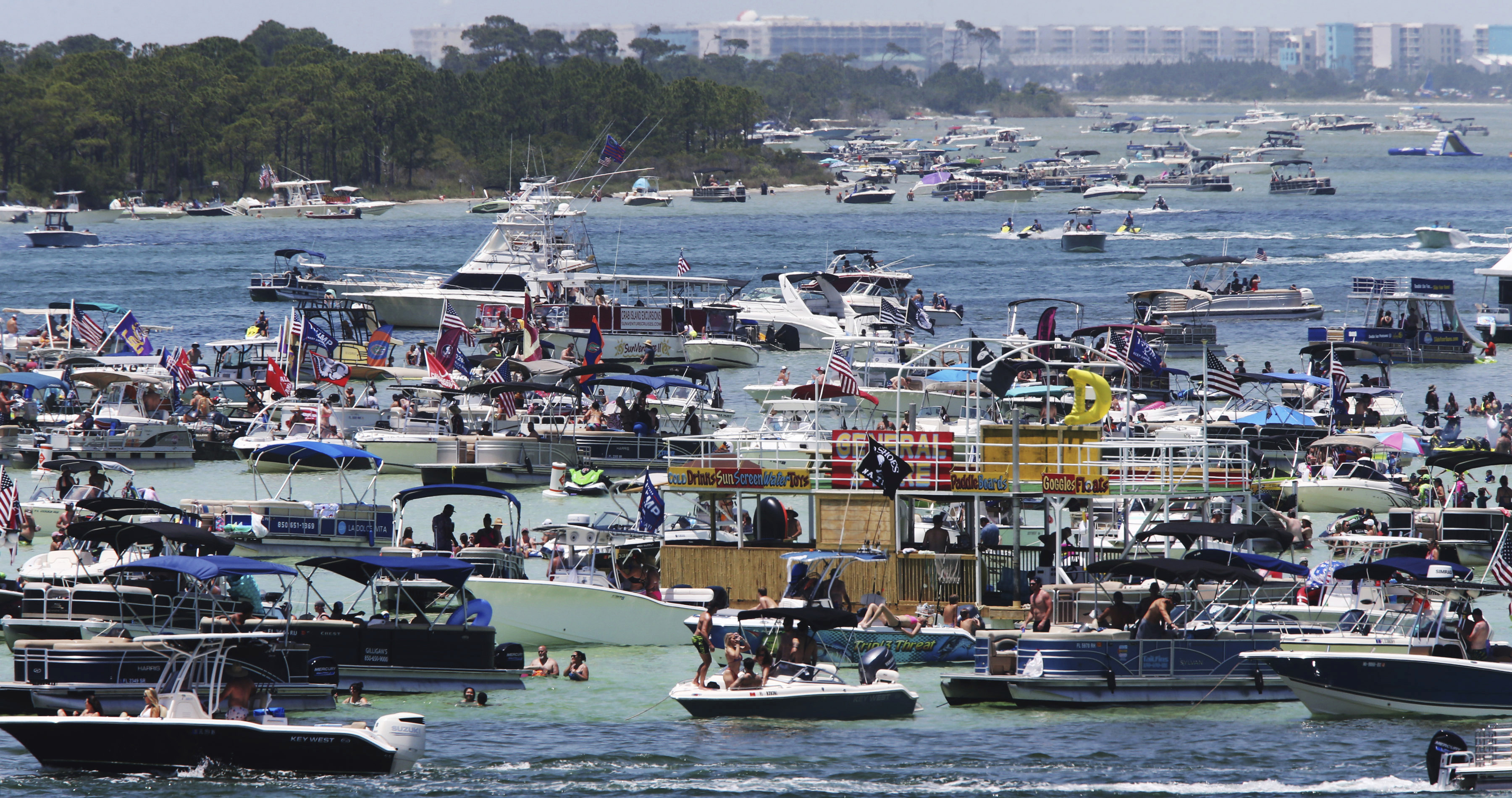 Boaters crowd an area known as "Crab Island" in the shallow waters near Destin,  Florida