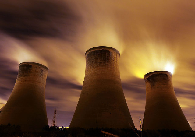 The coal fueled Fiddlers Ferry power station emits vapour into the night sky in Warrington, United Kingdom.