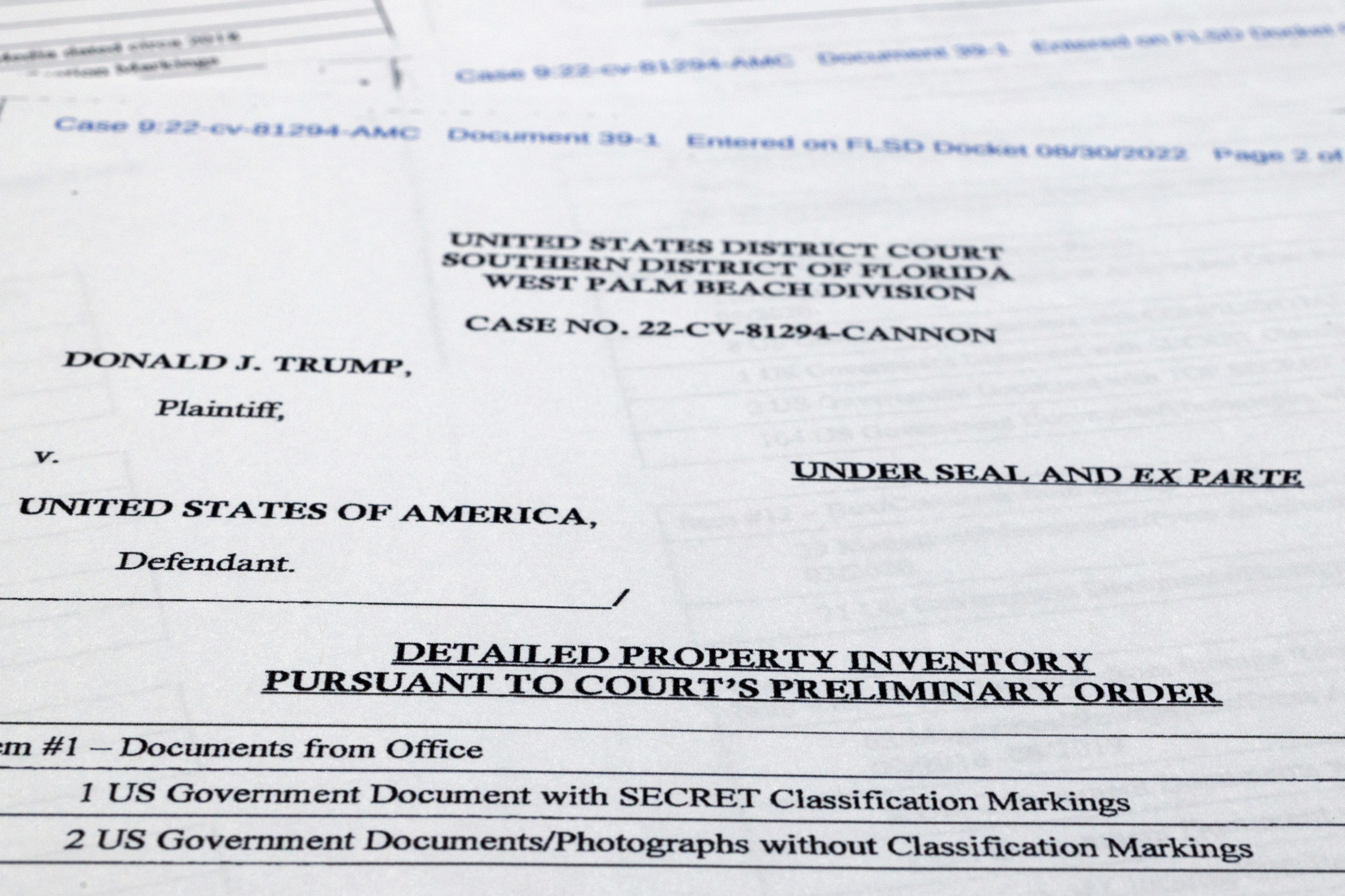 Pages from a FBI property list of items seized from former President Donald Trump's Mar-a-Lago estate and made public by the Department of Justice, are photographed Friday, Sept. 2, 2022. FBI agents who searched the home found empty folders marked with classified banners. The inventory reveals in general terms the contents of the 33 boxes taken during the Aug. 8 search. (AP Photo/Jon Elswick)