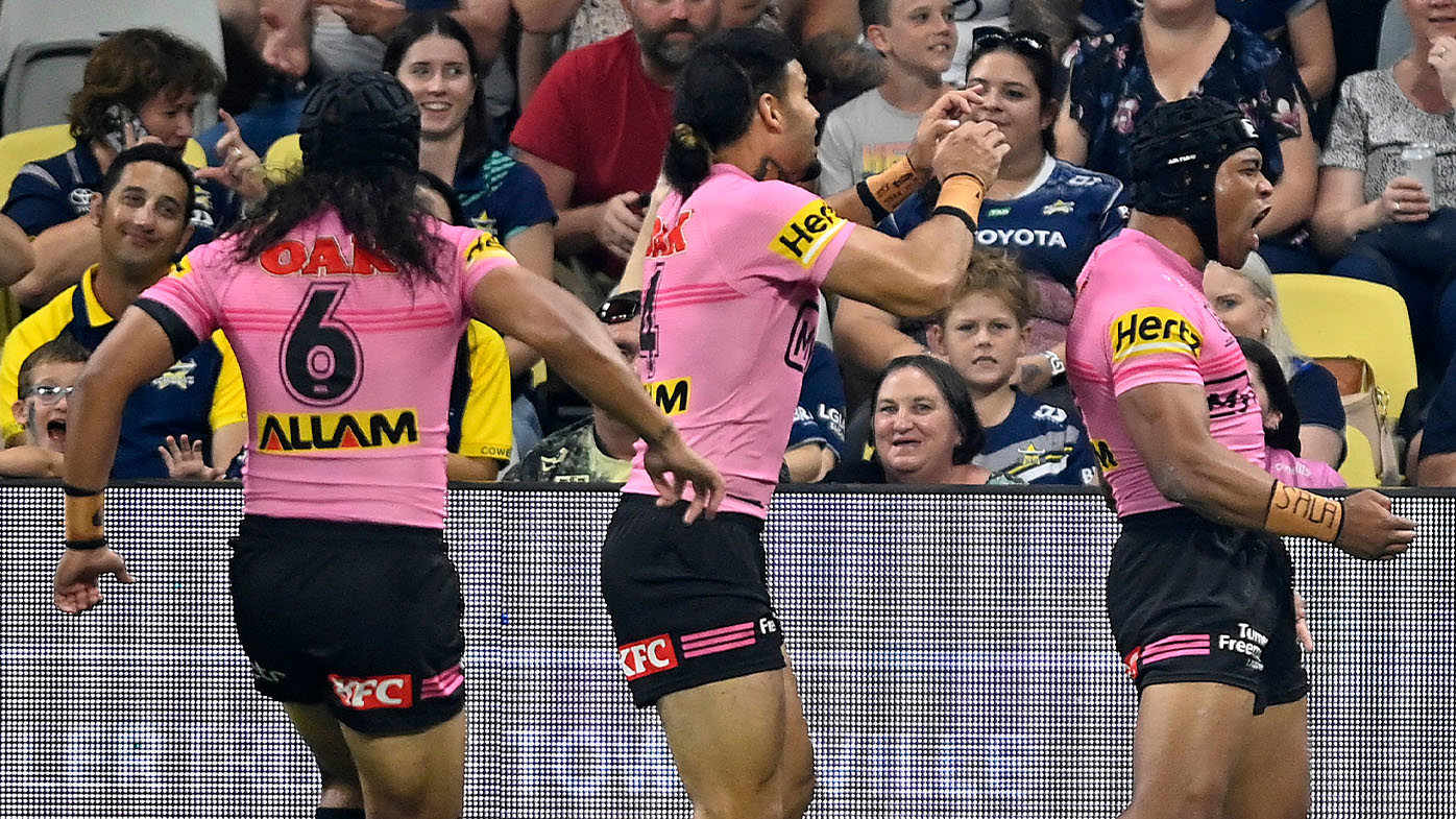 Brian To'o celebrates scoring a try in his 100th NRL match.