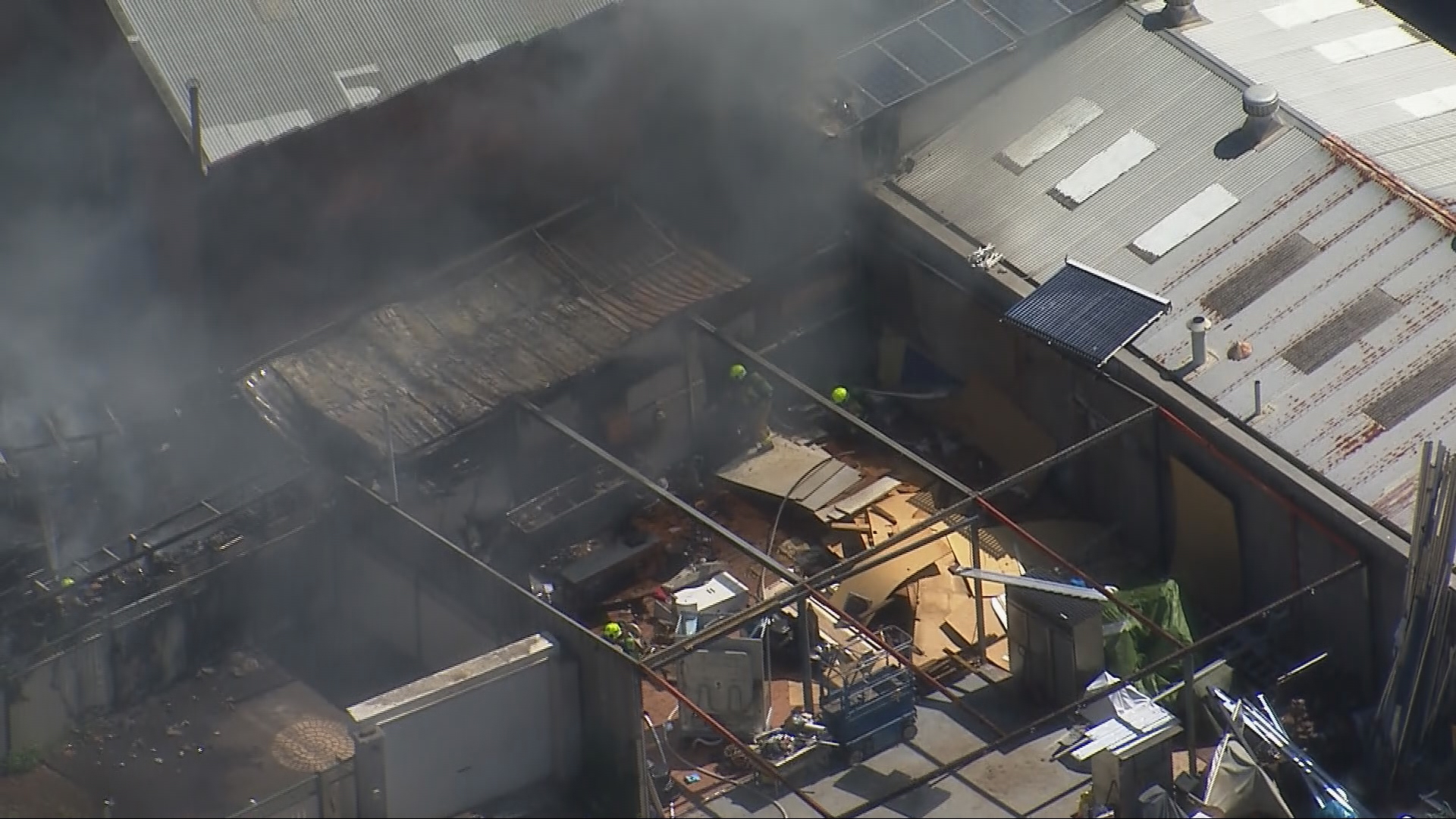 Dozens of firefighters are battling a blaze at a furniture factory in Sydney's west.﻿
