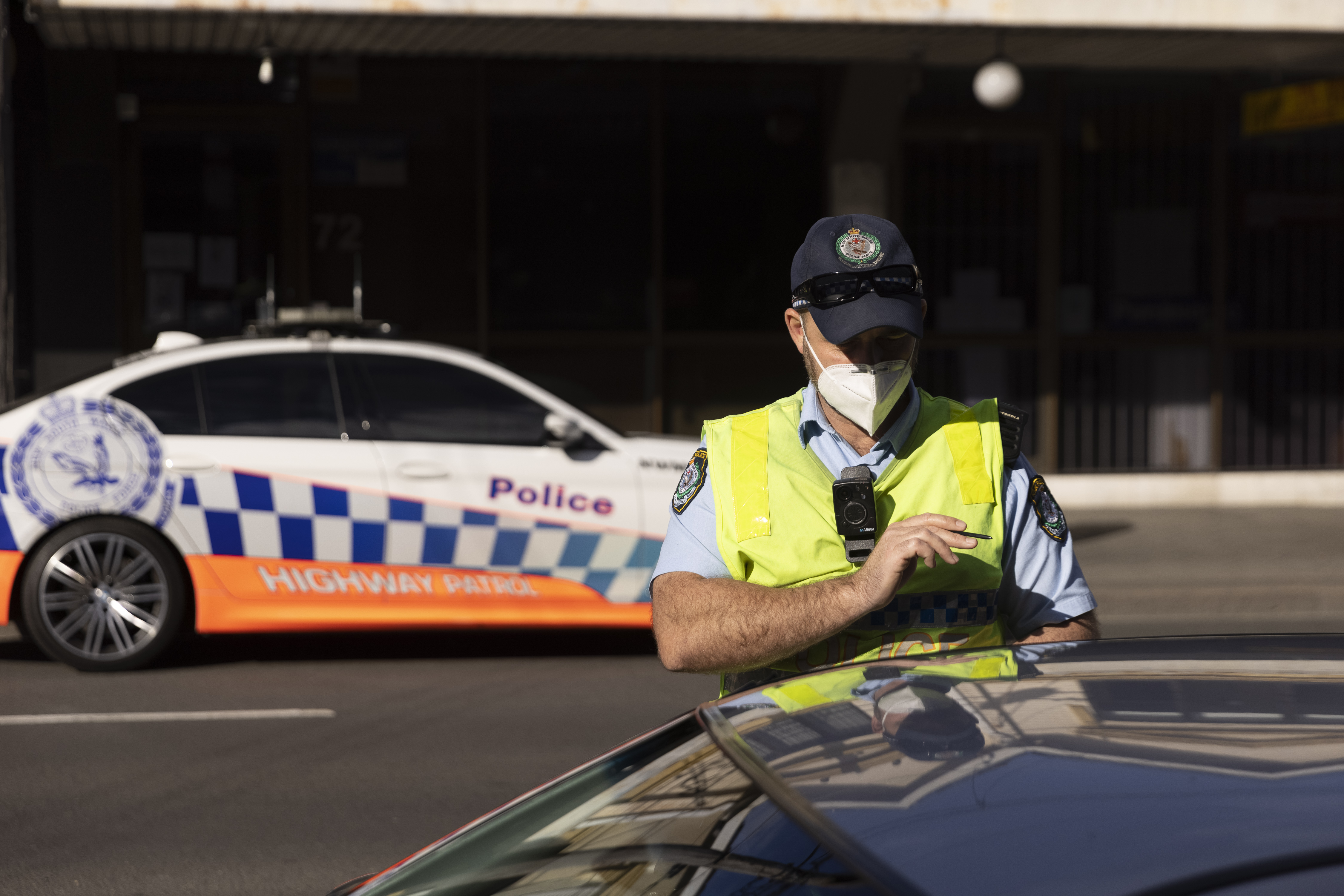 Police check drivers on Enmore Road as part of the enforcement of Public Health orders in Sydney.