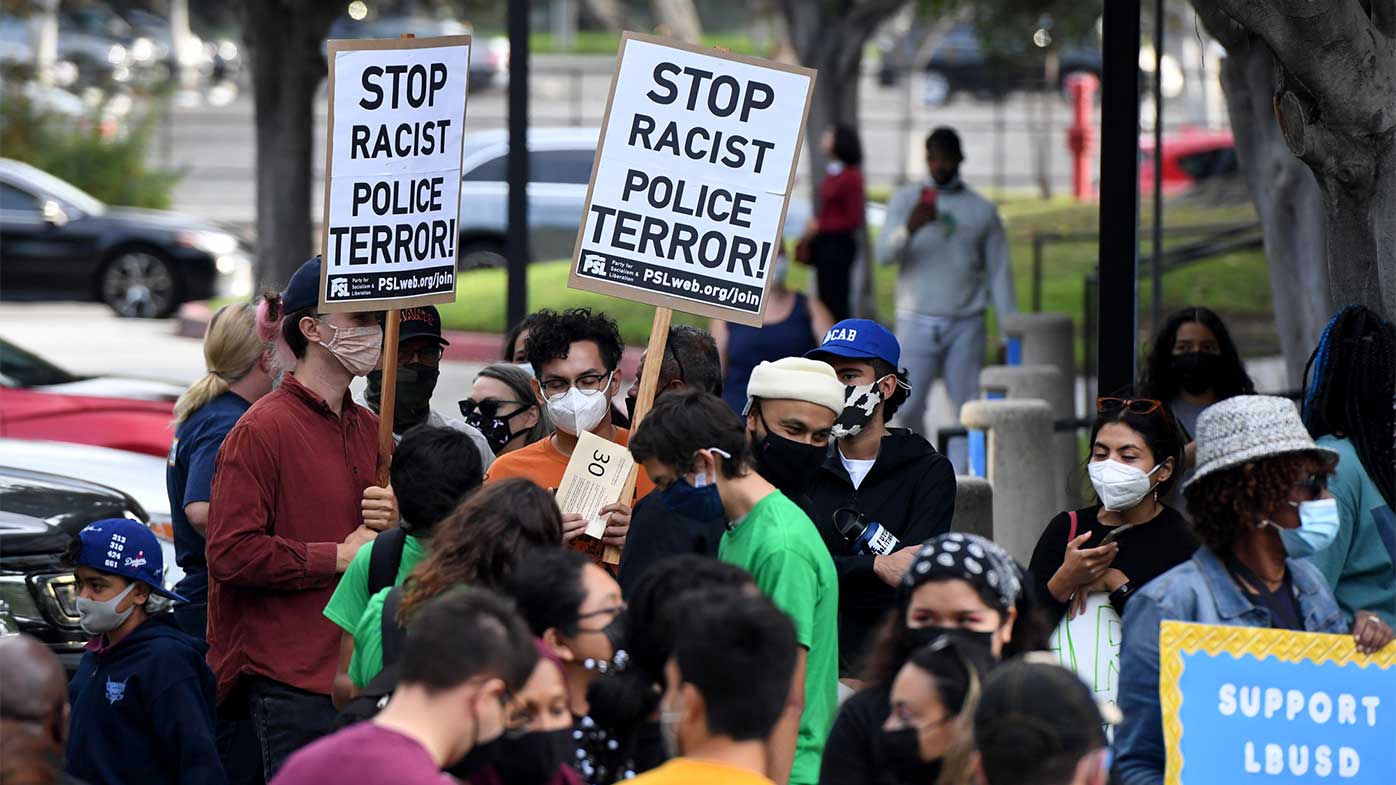 A crowd gathered October 6 in Long Beach, California, to learn that the school board unanimously voted to terminate a school safety officer involved in a deadly shooting.