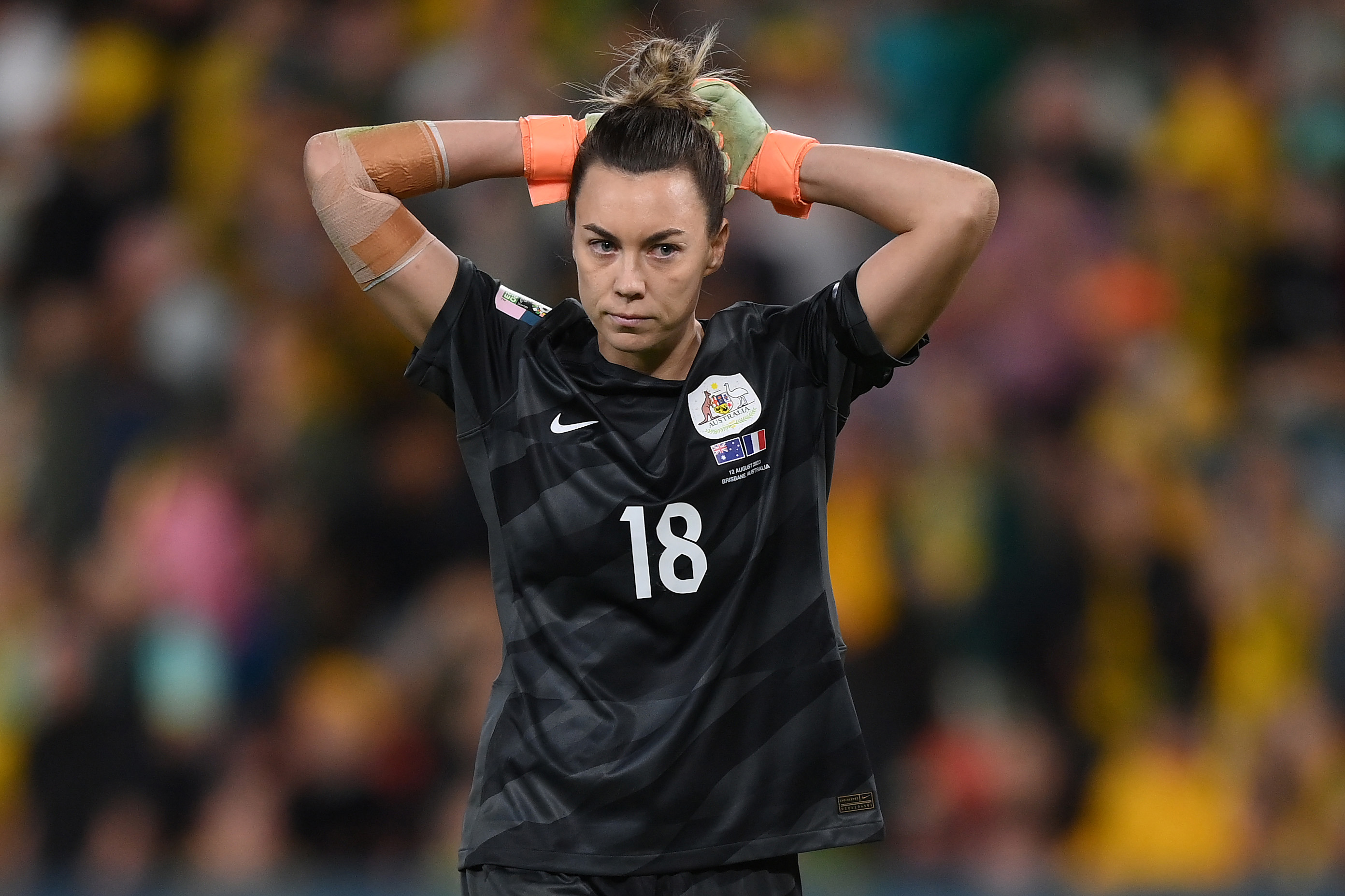 Mackenzie Arnold of Australia reacts after missing her team's fifth penalty in the shootout against France.