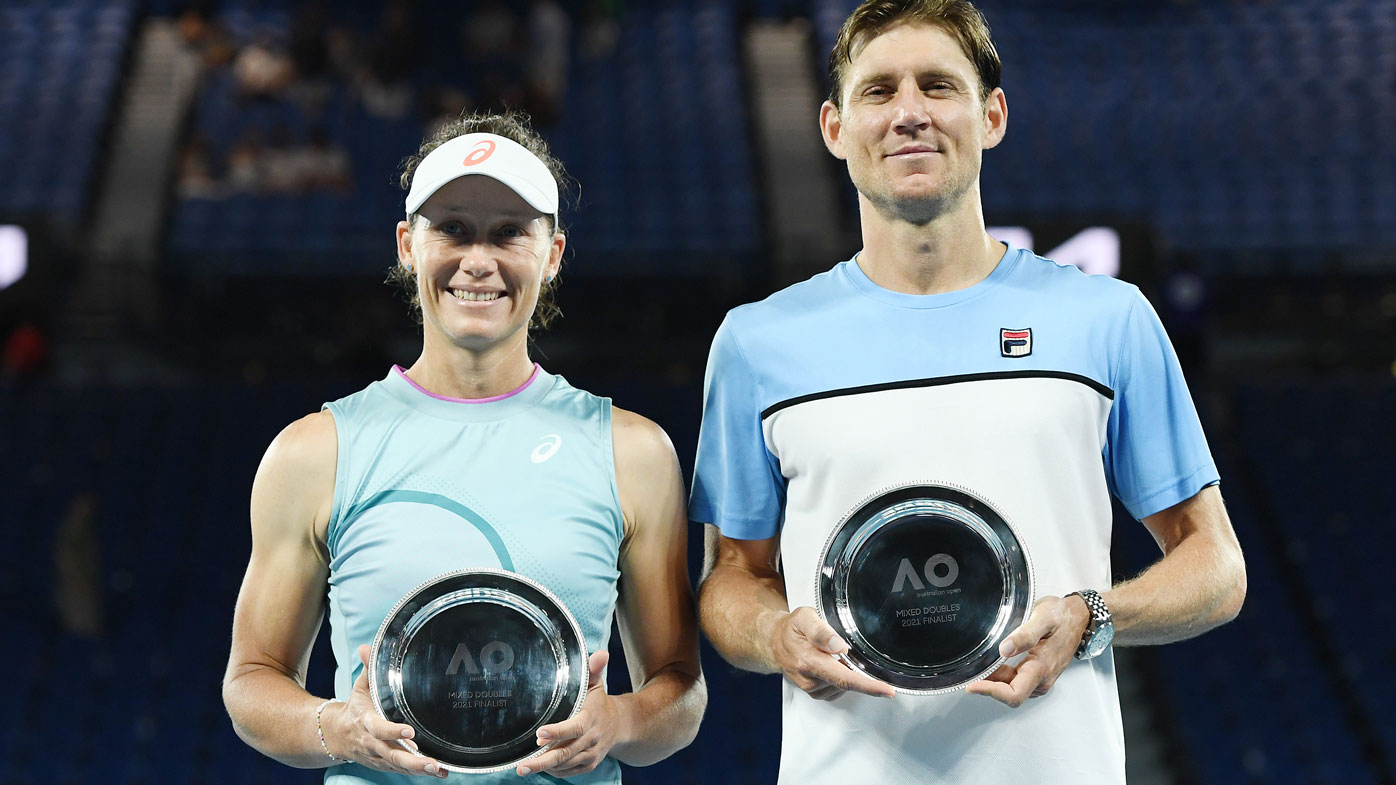 Samantha Stosur of Australia and Matthew Ebden of Australia pose with their runners up trophies after their Mixed Doubles Final match against Rajeev Ram of the United States and Barbora Krejcikova of the Czech Republic during day 13 of the 2021 Australian Open at Melbourne Park on February 20, 2021 in Melbourne, Australia