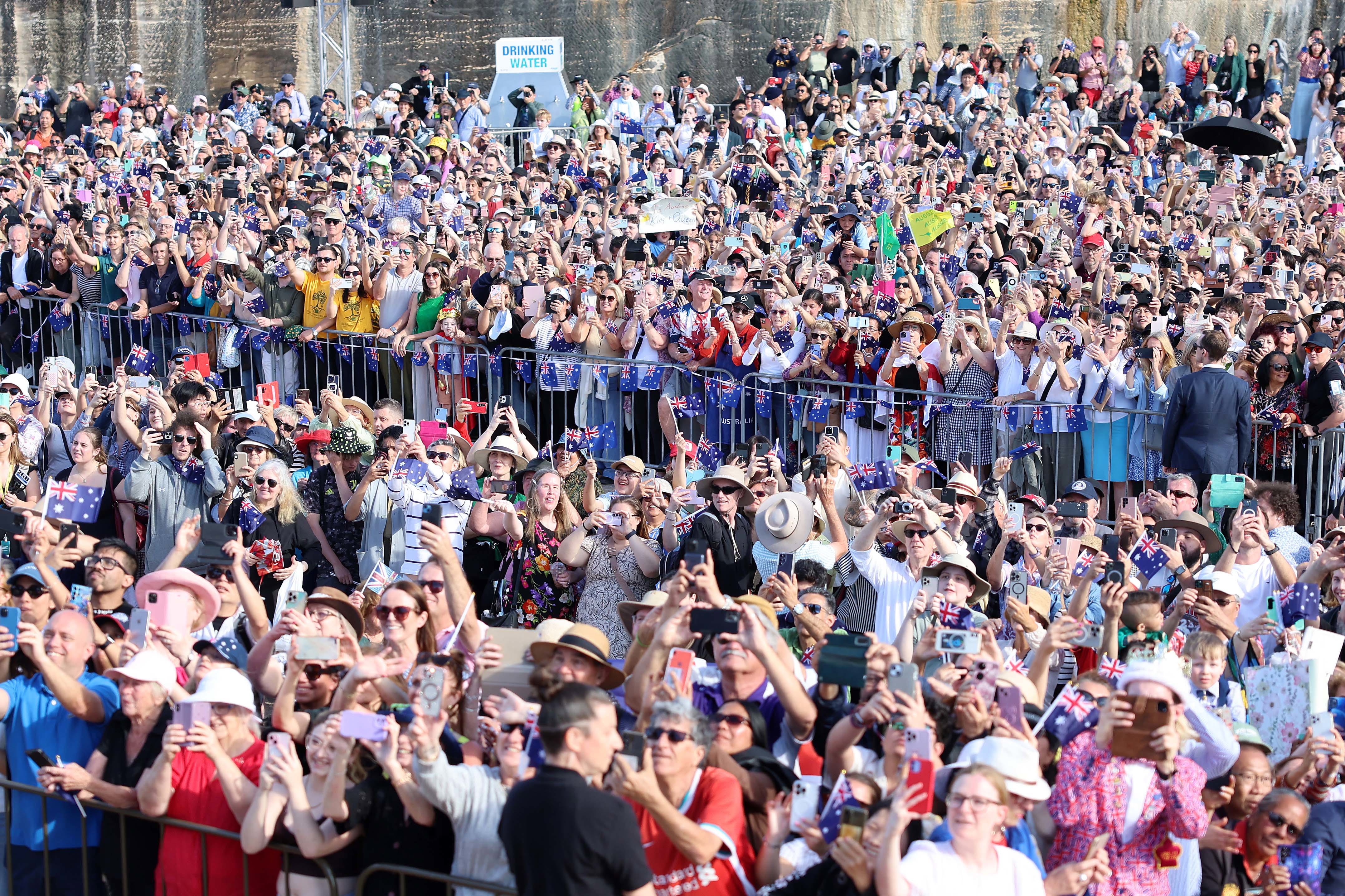 SYDNEY, AUSTRALIA - OCTOBER 22: Hundreds of people line the Forecourt at the Sydney Opera House to see King Charles III and Queen Camilla on October 22, 2024 in Sydney, Australia. The King's visit to Australia is his first as monarch, and the Commonwealth Heads of Government Meeting (CHOGM) in Samoa will be his first as head of the Commonwealth. (Photo by Chris Jackson/Getty Images)