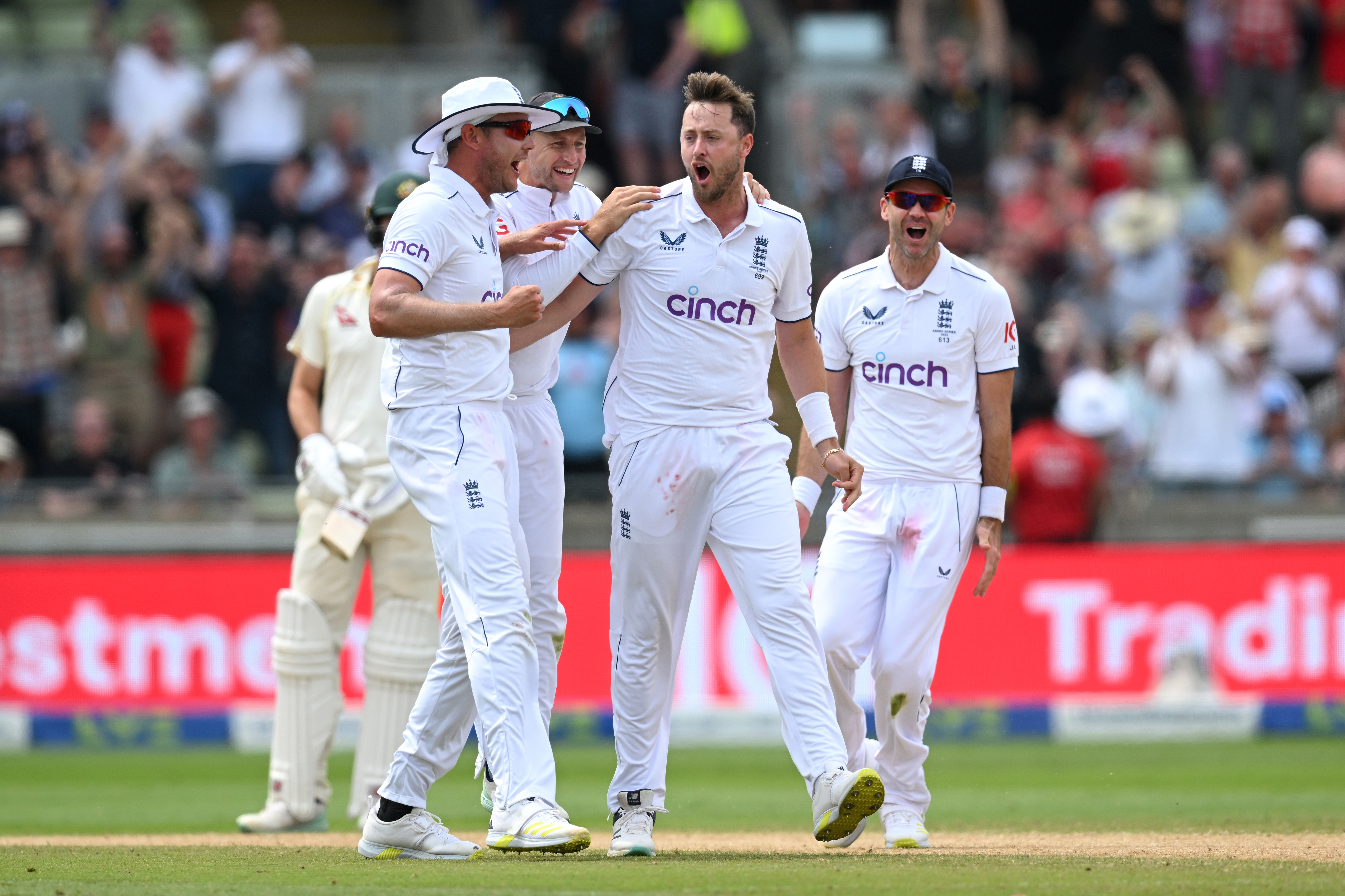 Ollie Robinson of England celebrates bowling Usman Khawaja of Australia with team mates during Day Three of the first Ashes Test match between England and Australia at Edgbaston.