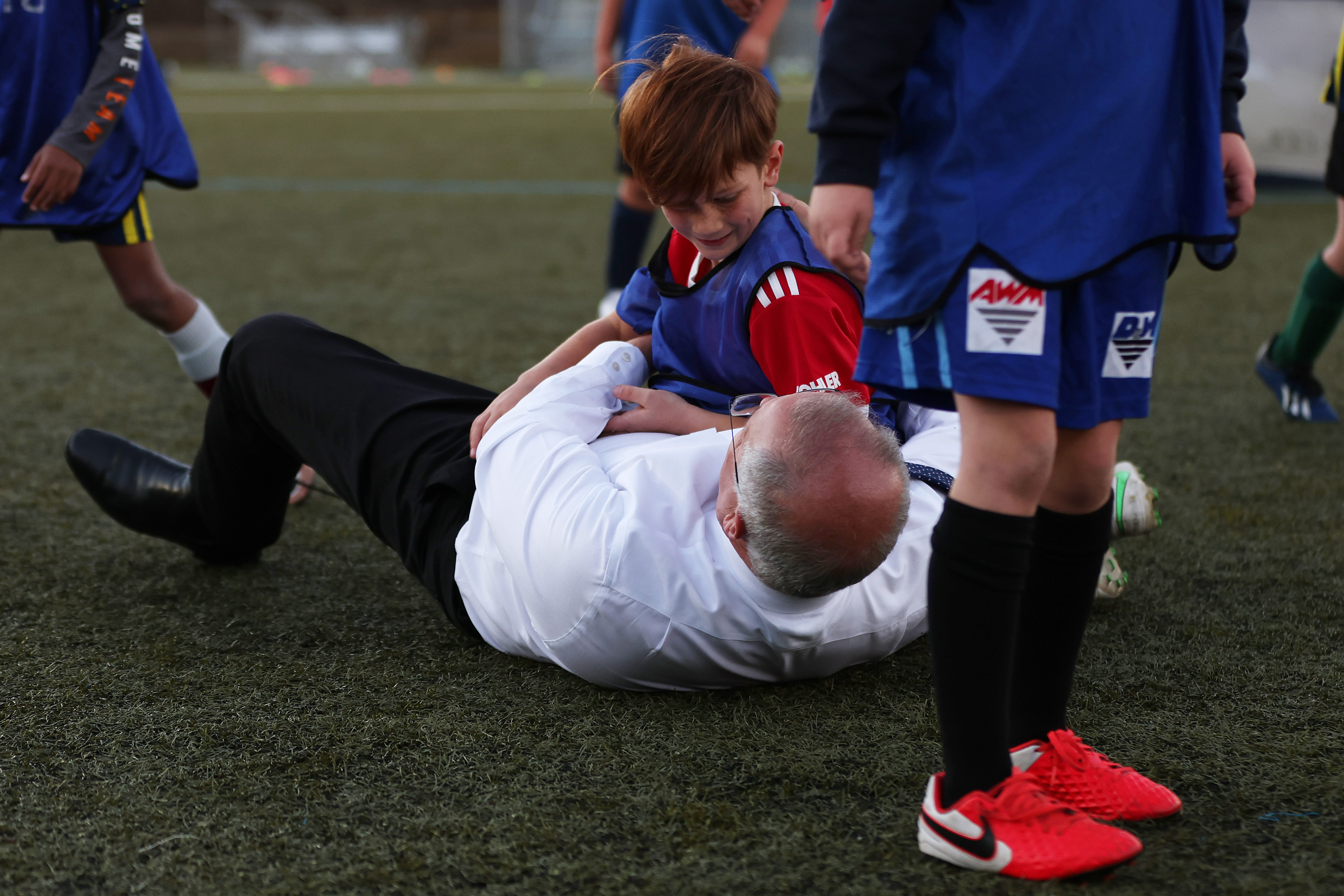 Prime Minister Scott Morrison accidentally knocks over a child during a visit to the Devonport Strikers Soccer Club, which is in the electorate of Braddon in Devonport, Australia. 