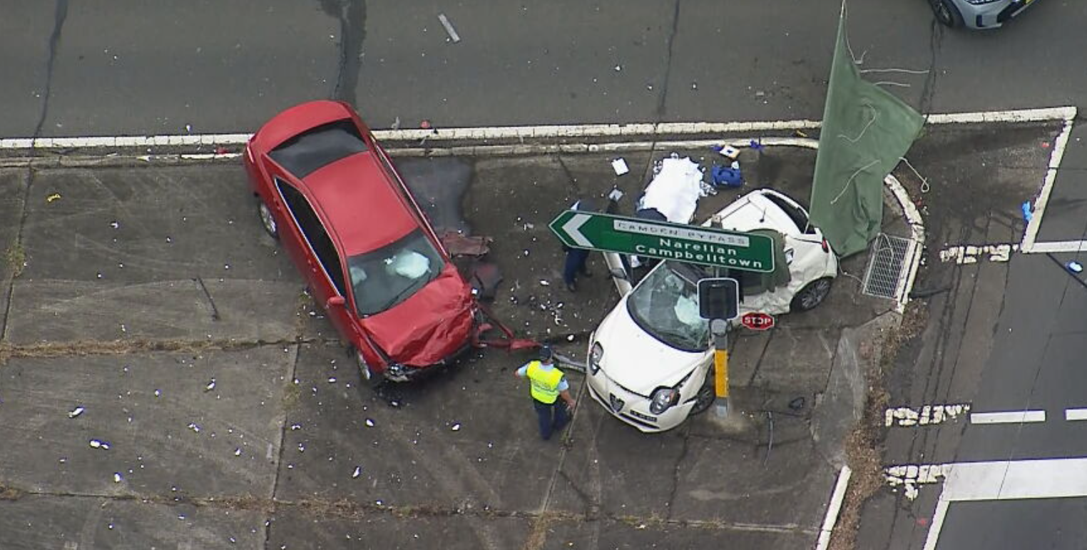 Two people have been killed and a driver has been arrested after a ﻿two-car crash in Sydney's south-west.