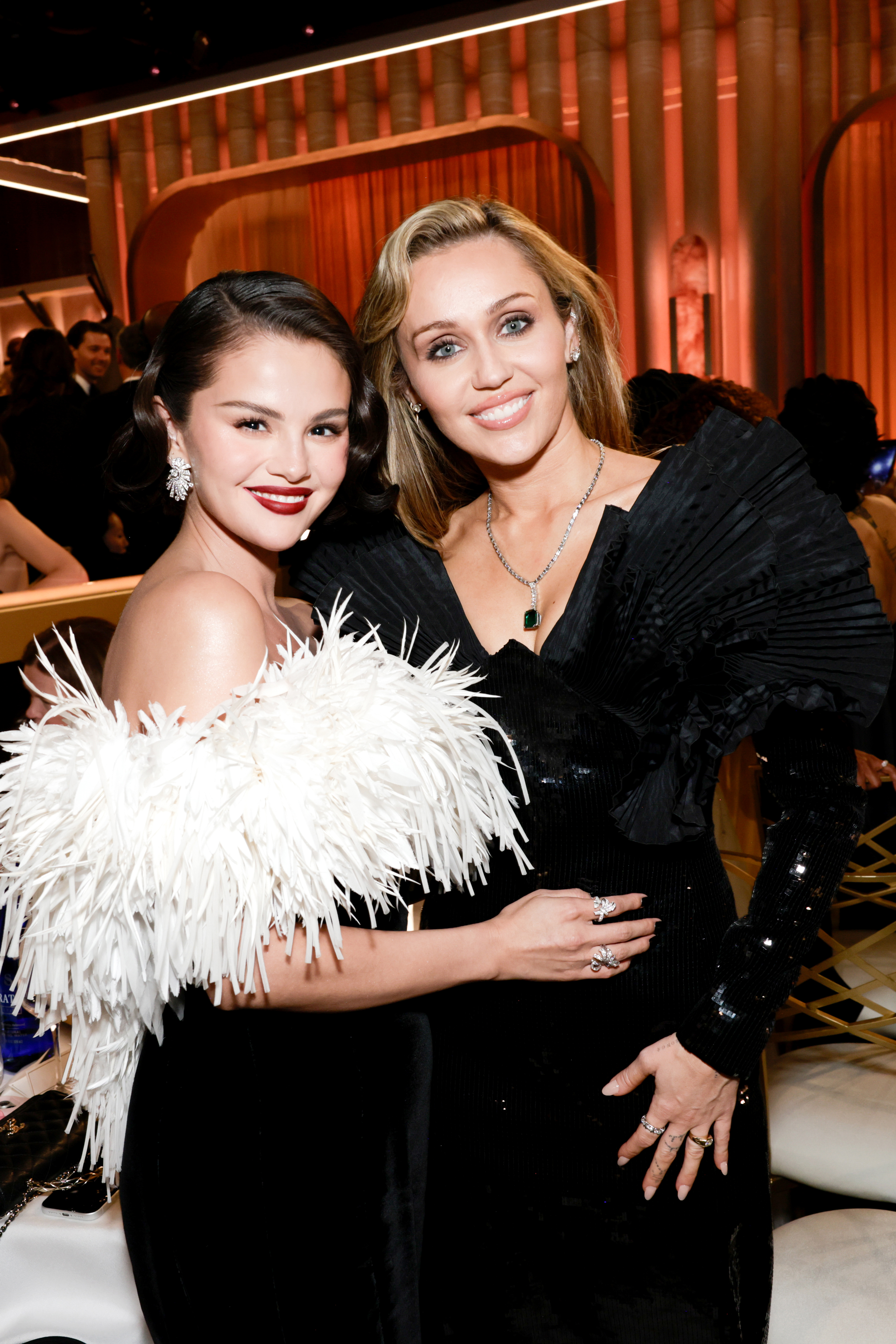 Selena Gomez and Miley Cyrus at the 83RD ANNUAL GOLDEN GLOBES®, airing live from the Beverly Hilton in Beverly Hills, California on Sunday, January 11, 2026 at 8 PM ET/5 PM PT, on CBS and streaming on Paramount+. Photo: Francis Specker/CBS ©2026 CBS Broadcasting, Inc. All Rights Reserved.