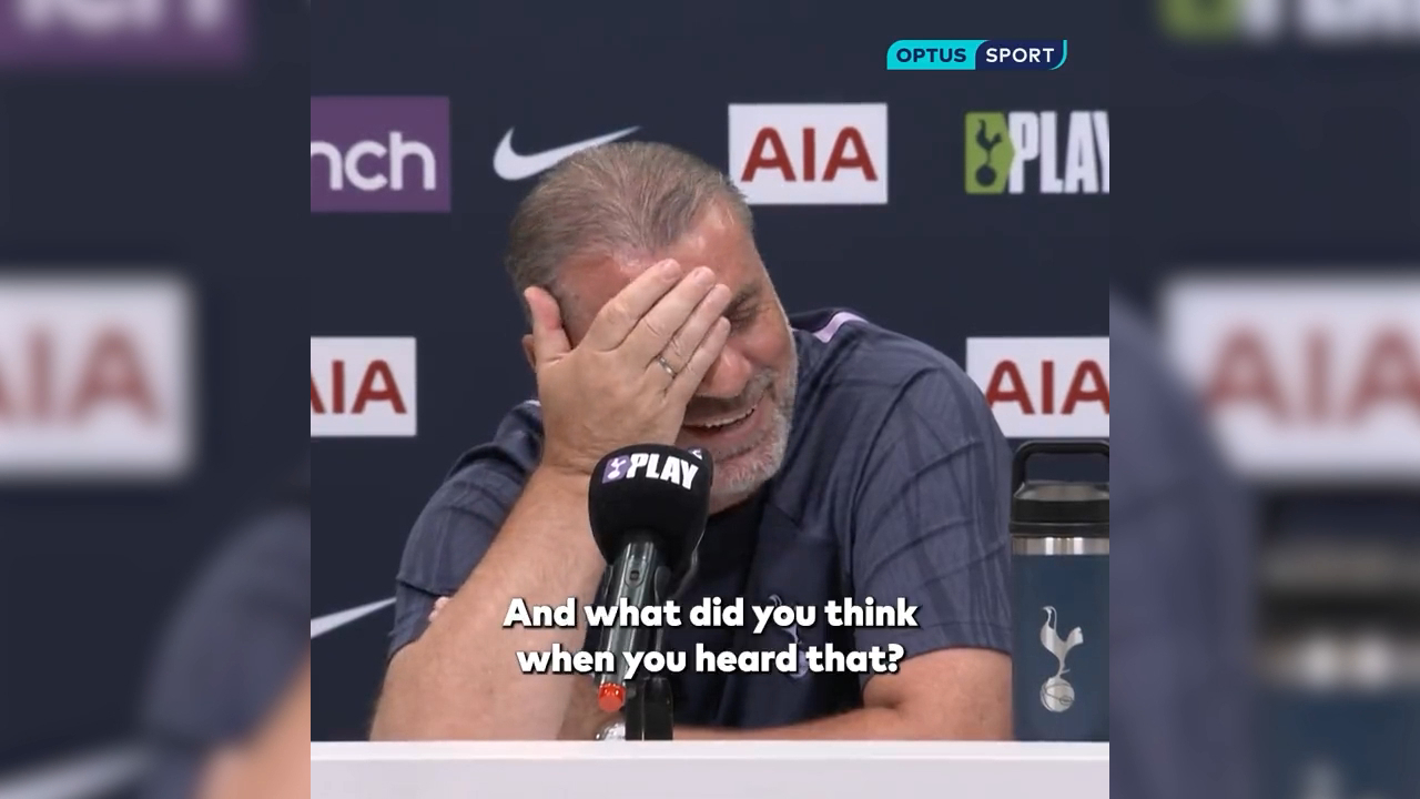 Ange Postecoglou reacts to a reporter's question.