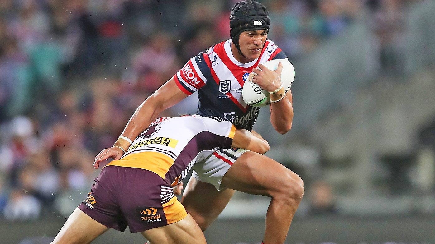  Joseph Suaalii of the Roosters is tackled