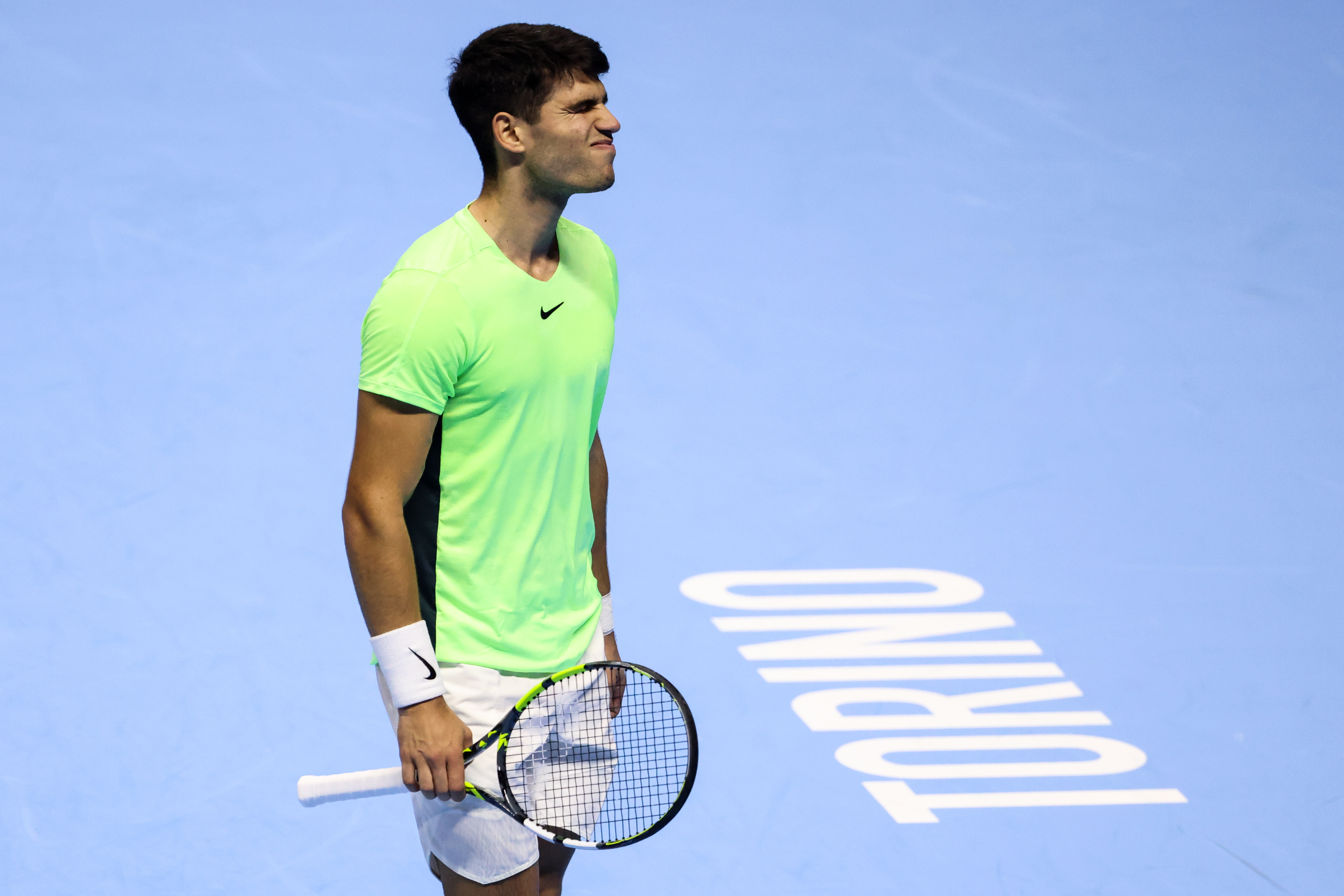 Carlos Alcaraz reacts during his round-robin match against Alexander Zverev at the ATP Finals.