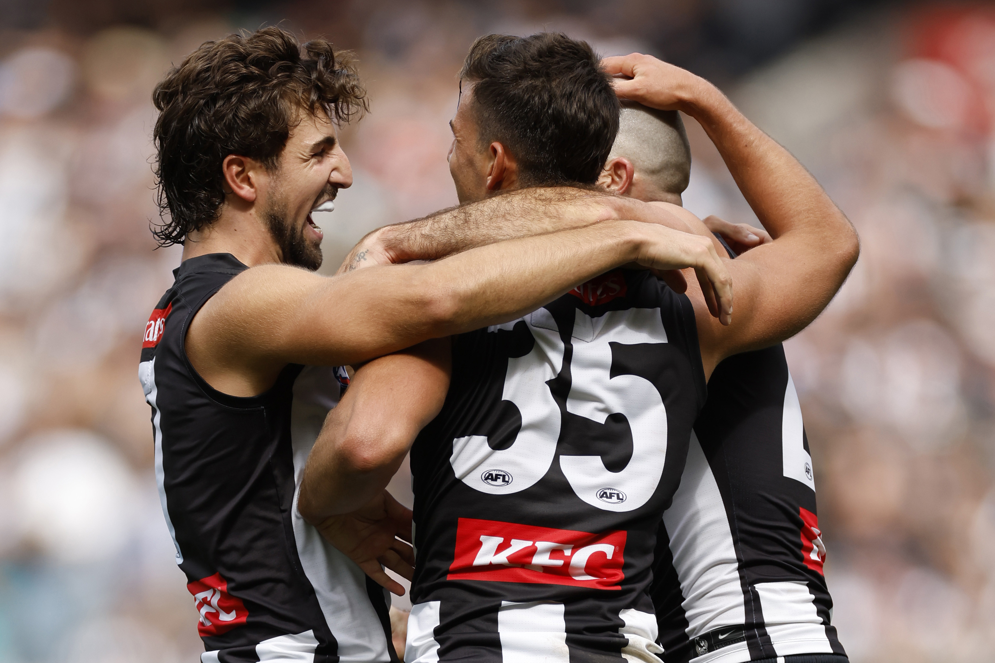MELBOURNE, AUSTRALIA - MARCH 25: Josh Daicos and Nick Daicos of the Magpies celebrate a goal during the round two AFL match between Collingwood Magpies and Port Adelaide Power at Melbourne Cricket Ground, on March 25, 2023, in Melbourne, Australia. (Photo by Darrian Traynor/Getty Images)