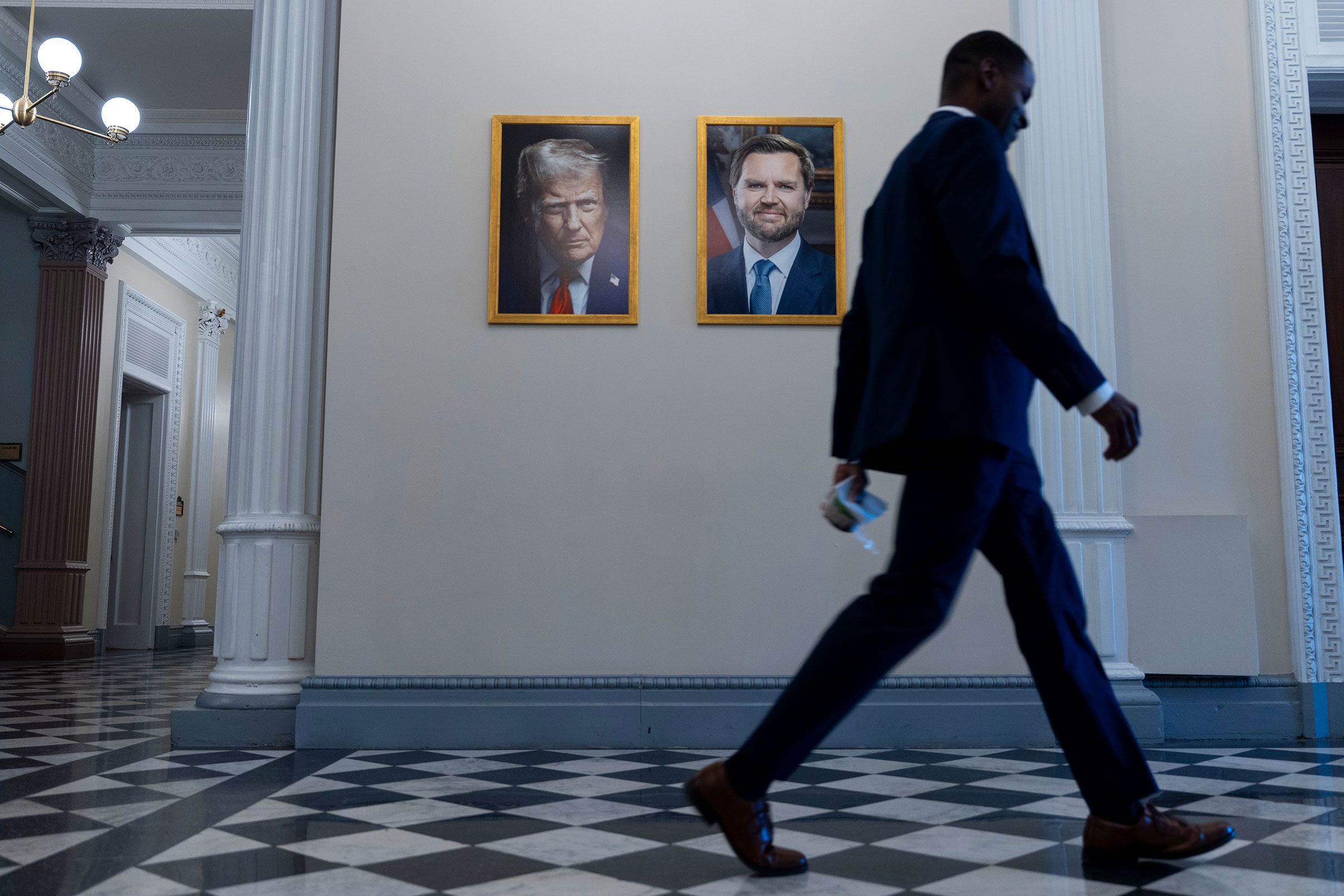 When President Donald Trump's new official portrait was unveiled Monday, it lacked two elements his predecessors had featured in their photographs dating back more than 50 years: a happy expression and an American flag in the background.