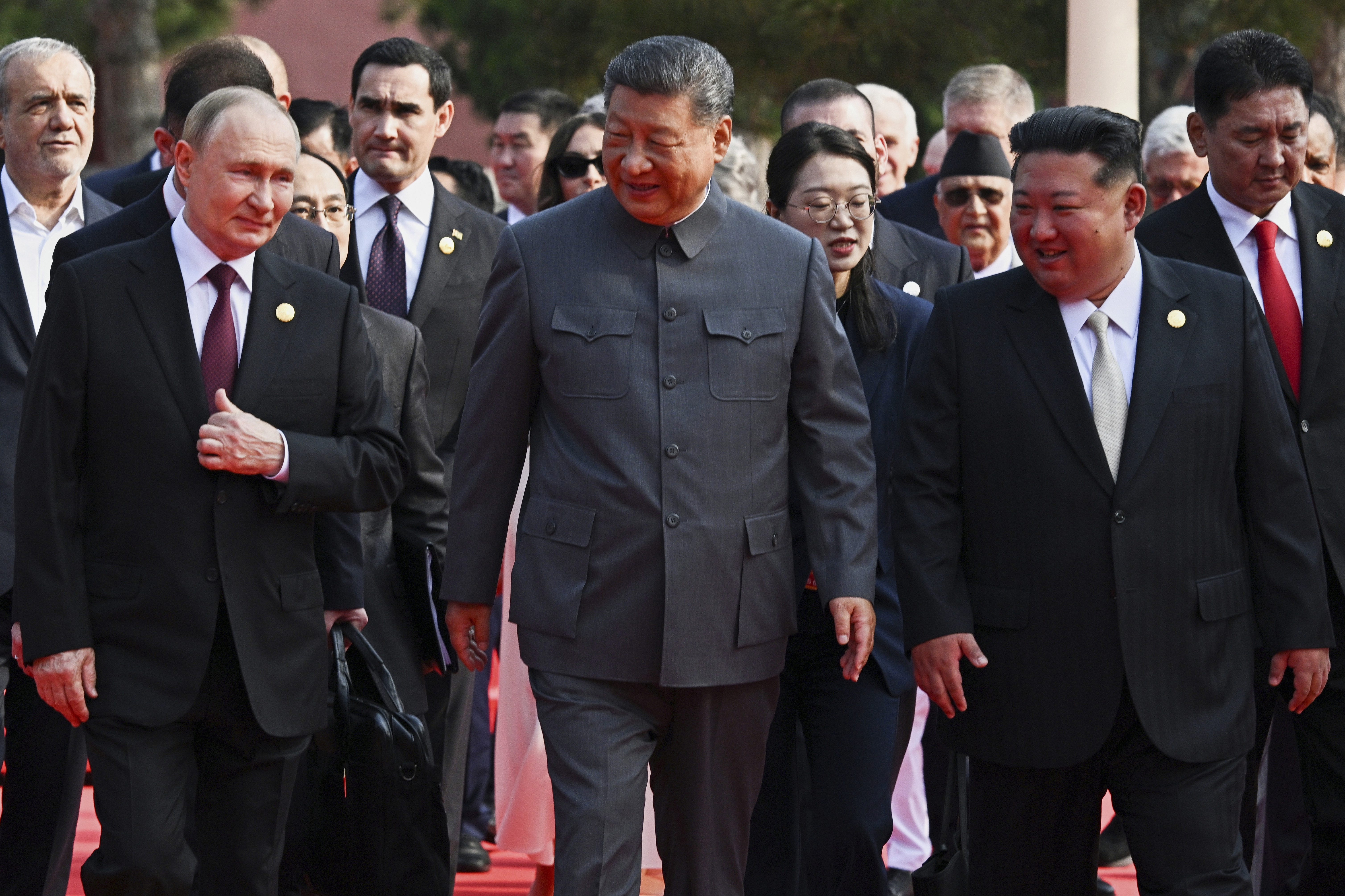 Front from left, Russian President Vladimir Putin, Chinese President Xi Jinping and North Korean leader Kim Jong Un arrive at a military parade.
