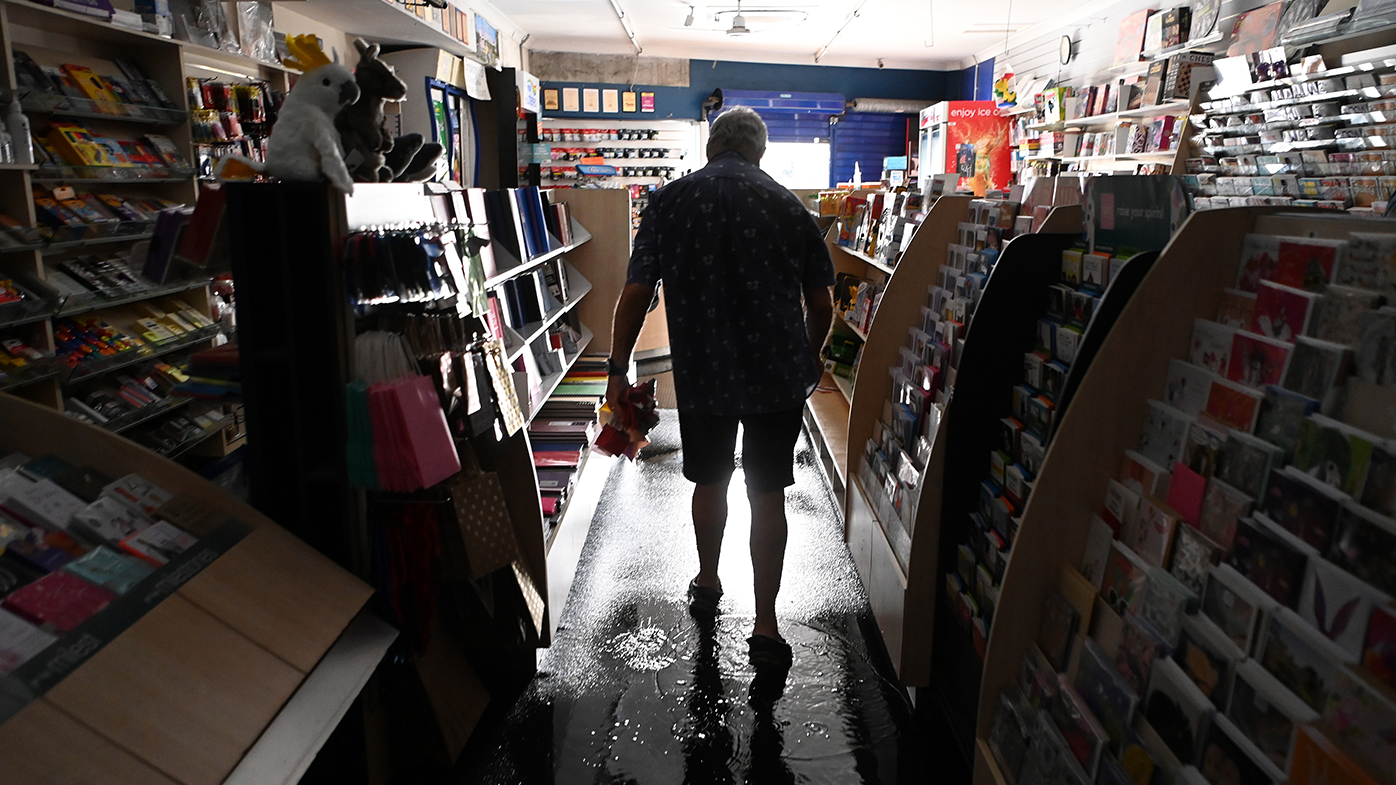 News Agency owner Ron Delardes discards flood-affected items from his business on March 30, 2022 in Byron Bay, Australia.